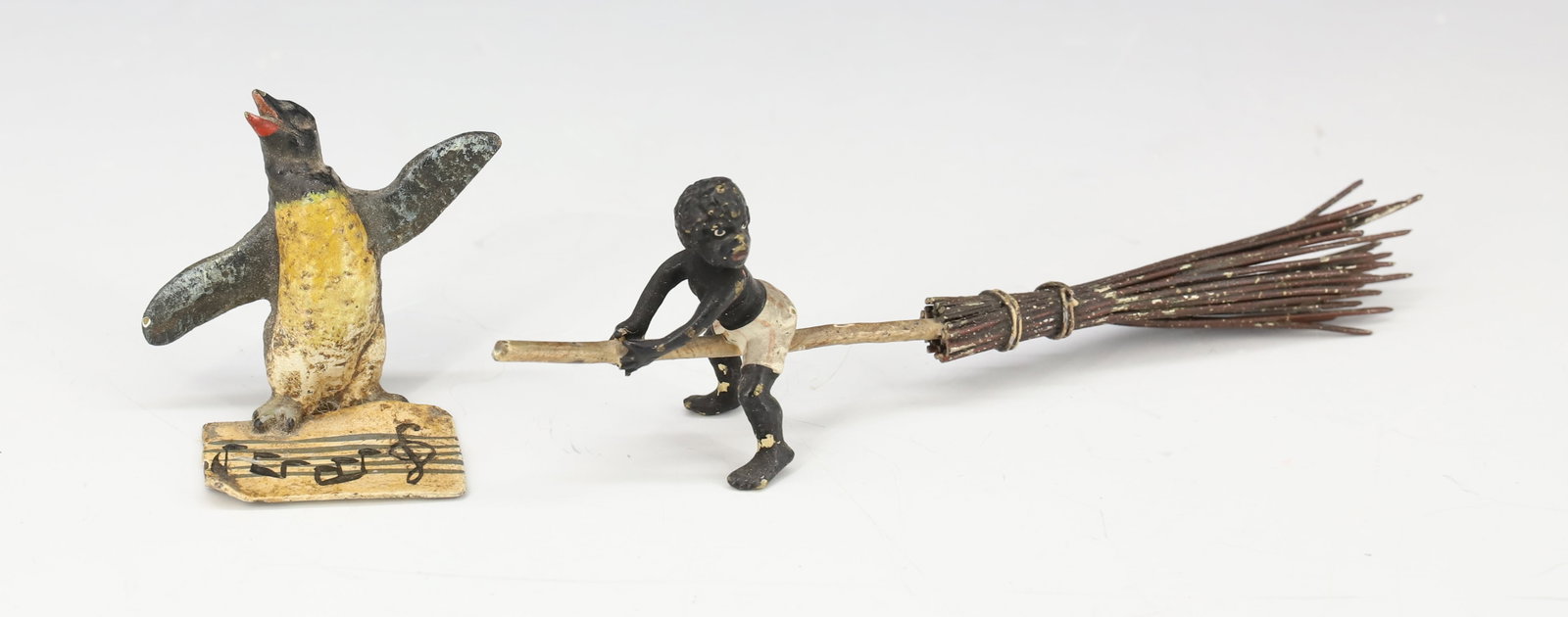 (2) VIENNA BRONZE BLACK BOY,PENGUIN: HAND PAINTED BLACK BOY ON BROOM, PENGUIN WITH SHEET MUSIC SINGING 4"L,1 1/4"H PLEASE READ CAREFULLY - Terms for Purchasing and Shipping of Auction Items. Please read carefully before bidding. All paym