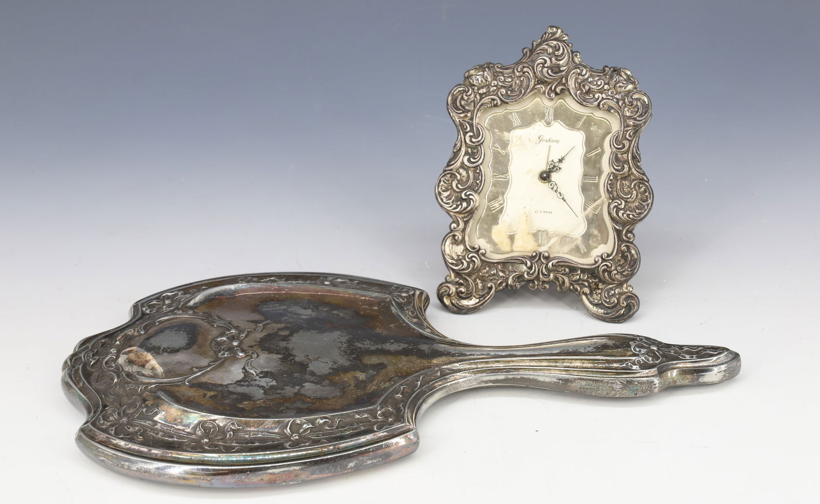 (2) STERLING SILVER GORHAM CLOCK: GORHAM BOUDOIR CLOCK STERLING FRAME AND DIAL, SILVERPLATE HAND MIRROR 5"H,10 1/2" X 5 1/2" PLEASE READ CAREFULLY - Terms for Purchasing and Shipping of Auction Items. Please read carefully before bidd