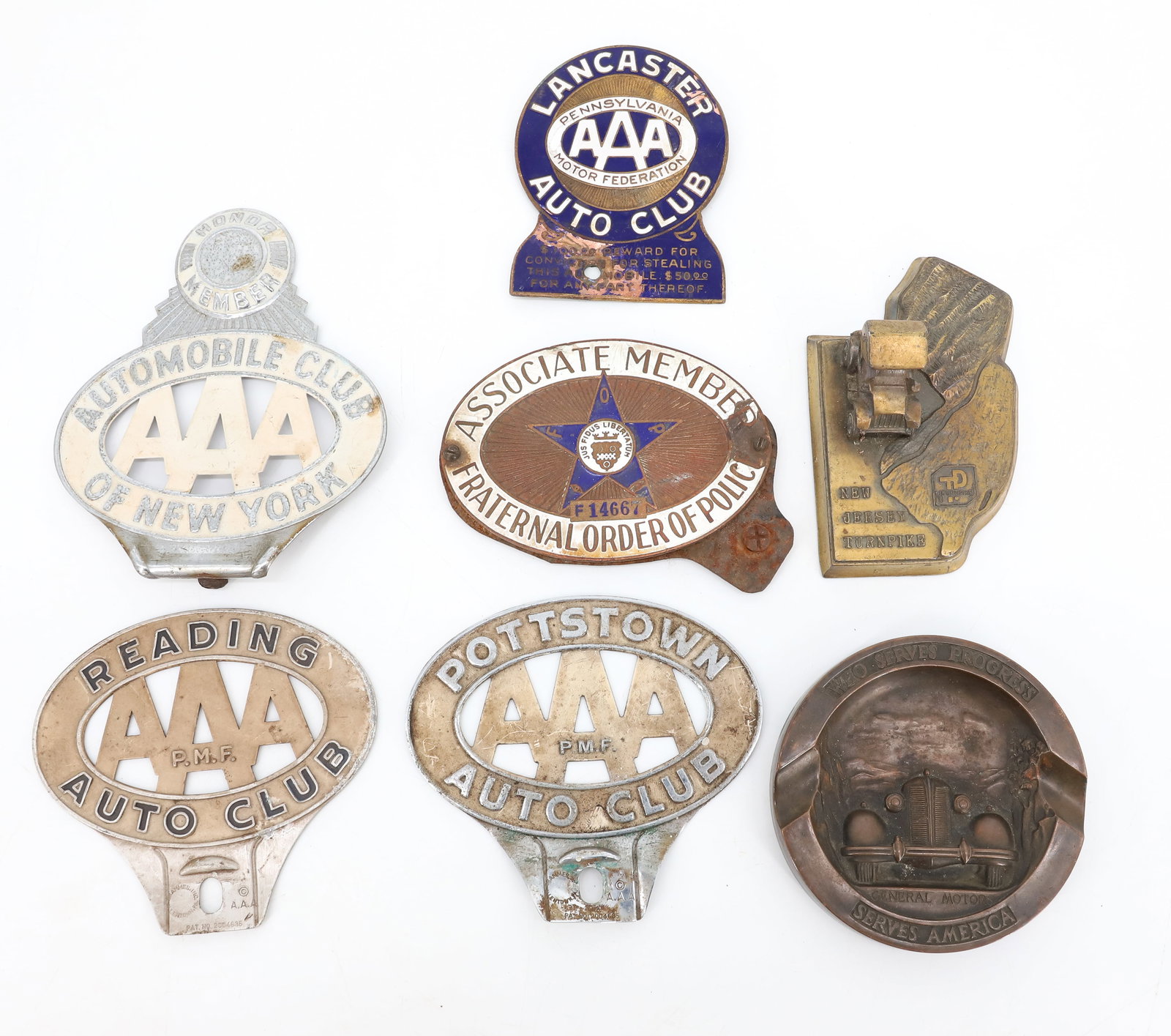LOT OF VINTAGE AUTO BADGES AND ADVERTISING ASHTRAY: TRIPLE AAA AUTO CLUB BADGES, NEW YORK, LANCASTER, READING, AND MORE - WITH BRONZE GENERAL MOTORS ASHTRAY AND NEW JERSEY TURNPIKE SOUVENIR PLEASE READ CAREFULLY - Terms for Purchasing and Shipping of A