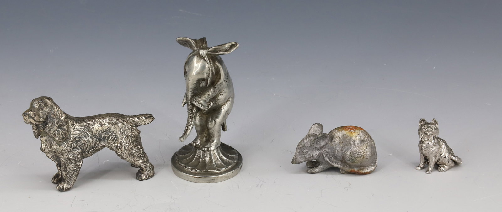 LOT OF MINIATURE PEWTER ANIMALS: INCLUDING: ELEPHANT W/ TOOTHACHE 2 1/2" H., DOG, CAT AND MOUSE. PLEASE READ CAREFULLY - Terms for Purchasing and Shipping of Auction Items. Please read carefully before bidding. All payments for purch