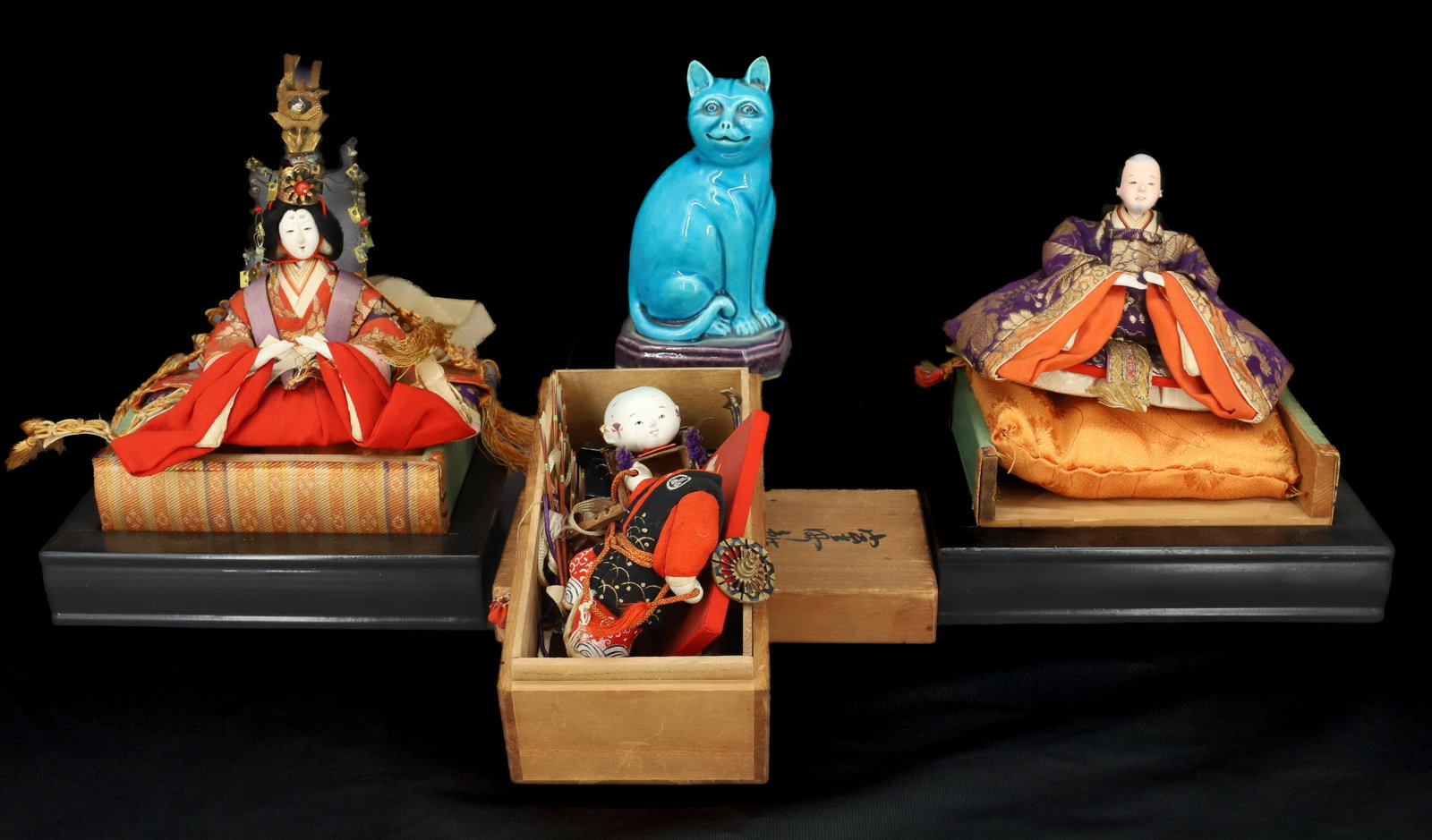 LOT OF ASIAN ITEMS: INCLUDING - PORCELAIN "CHINA" CAT (5 1/4") - (3) CHINESE FIGURES IN WOODEN BOXES - PAINTED WOOD AND TEXTILE. 5 1/2" W. PLEASE READ CAREFULLY - Terms for Purchasing and Shipping of Auction Items. Pleas