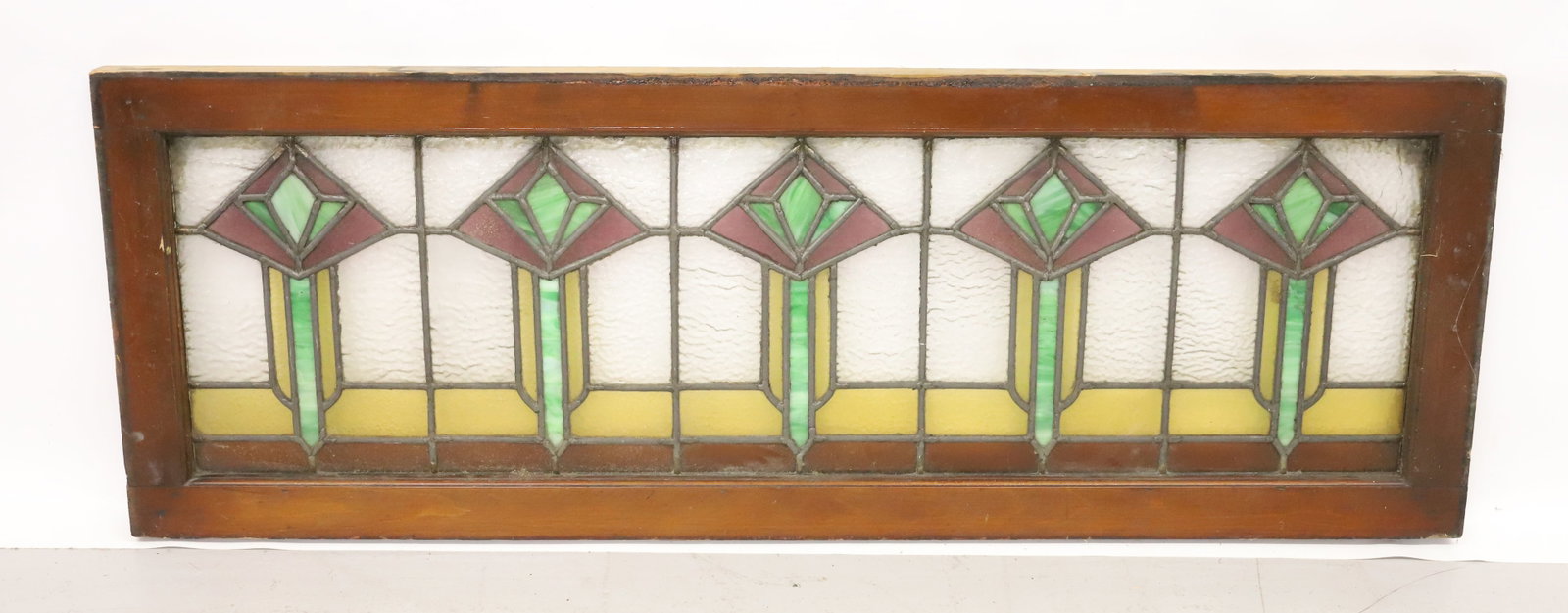 ART DECO LEADED GLASS WINDOW: YELLOW/AMETHYST/GREEN SLAG GLASS IN WOODEN FRAME. 18 1/2" X 52 1/2". PLEASE READ CAREFULLY - Terms for Purchasing and Shipping of Auction Items. Please read carefully before bidding. All payments for 