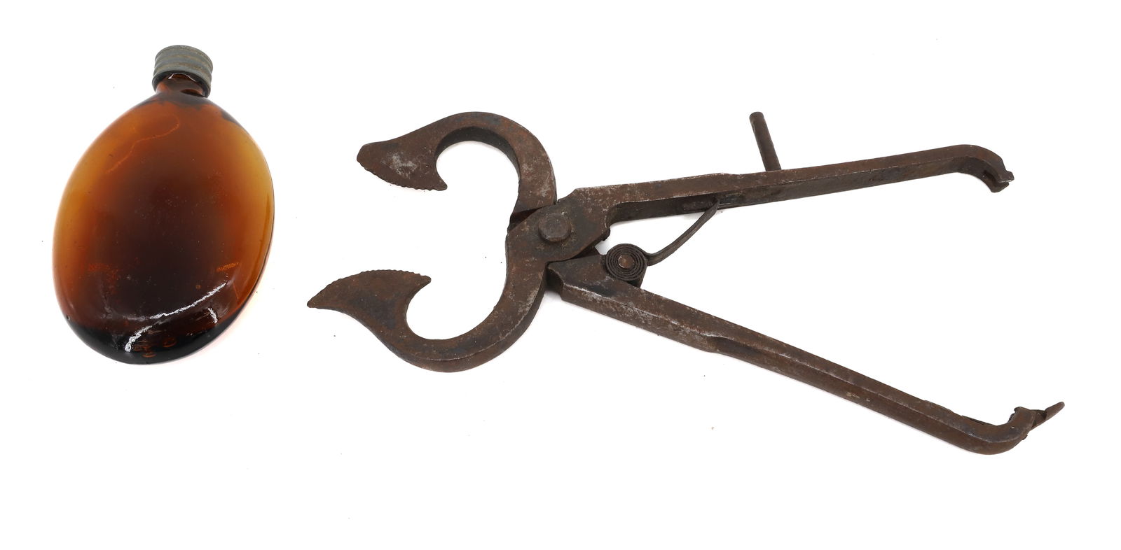 SUGAR NIPS AND AMBER POCKET FLASK: EARLY "SPRING LOADED" SUGAR NIPS 10"L WITH AMBER POCKET FLASK 4 3/4" PLEASE READ CAREFULLY - Terms for Purchasing and Shipping of Auction Items. Please read carefully before bidding. All payments for