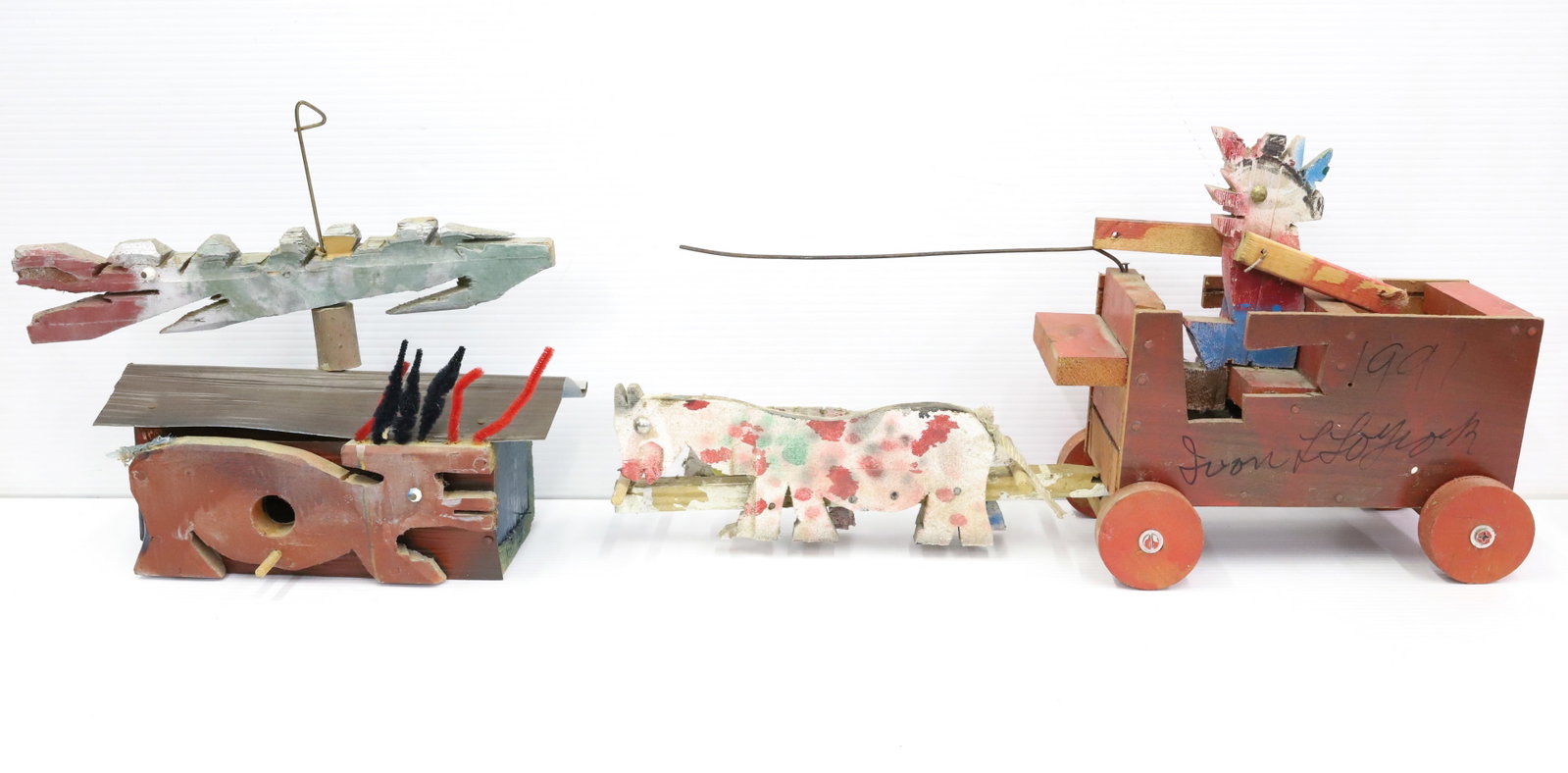 FOLK ART BIRDHOUSE AND WAGON: HANDCRAFTED WOODEN BIRDHOUSE WITH LARGE "WHIRLIGIG" ON TOP. PAINTED WOOD/METAL. 11" L. WITH, PAINTED WOODEN WAGON WITH DRIVER AND TWO POLKA DOT HORSES. 21 1/2". PLEASE READ CAREFULLY - Terms for Purch