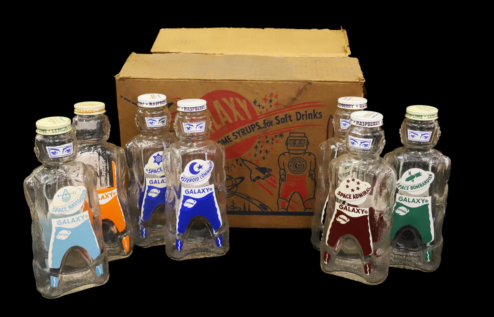 GALAXY SYRUP BOTTLES: (7) SYRUP BOTTLES IN ORIGINAL CARDBOARD BOX. BOTTLES 8 1/2" H. PLEASE READ CAREFULLY - Terms for Purchasing and Shipping of Auction Items. Please read carefully before bidding. All payments for purcha