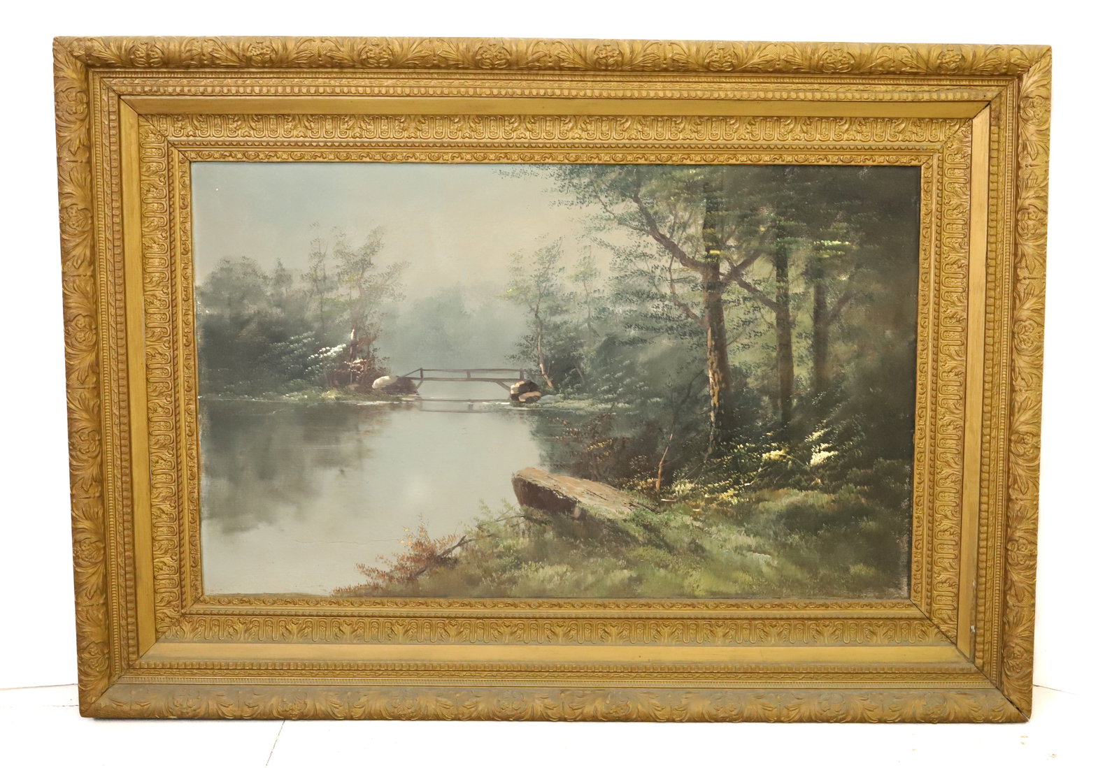 LARGE OIL ON CANVAS: TRANQUIL CREEK SCENE WITH BRIDGE IN BACKGROUND SURROUNDED BY FOREST AND GROWTH. UNSIGNED. ORNATE GOLD FRAME. TOTAL SIZE 33" X 47". PLEASE READ CAREFULLY - Terms for Purchasing and Shipping of Auction 