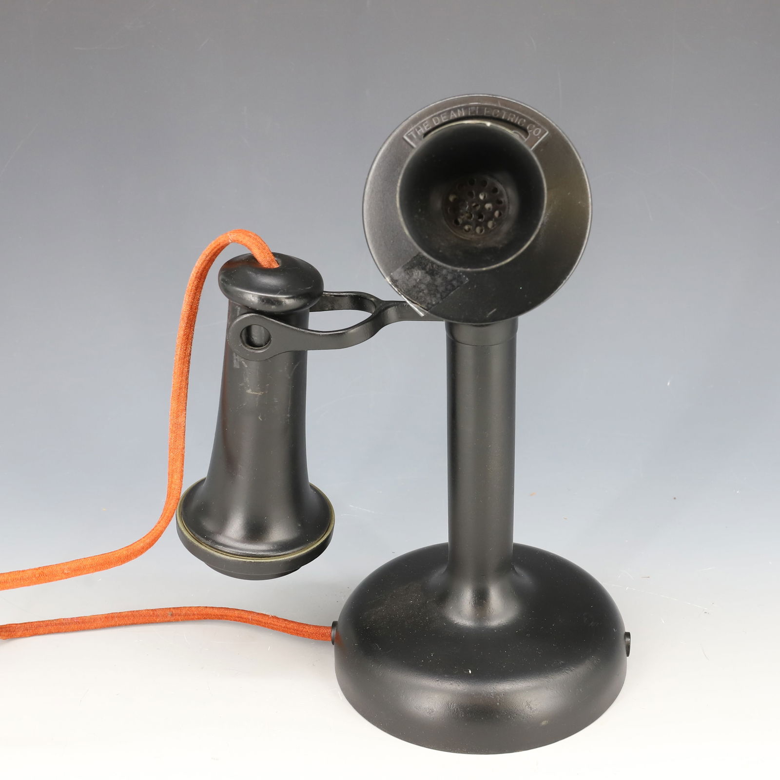 DEAN ELECTRIC CANDLESTICK PHONE: BLACK PAINTED METAL. MRKD. ON EARPIECE AND ABOVE MOUTHPIECE. 607984C. 10" H. PLEASE READ CAREFULLY - Terms for Purchasing and Shipping of Auction Items. Please read carefully before bidding. All payme