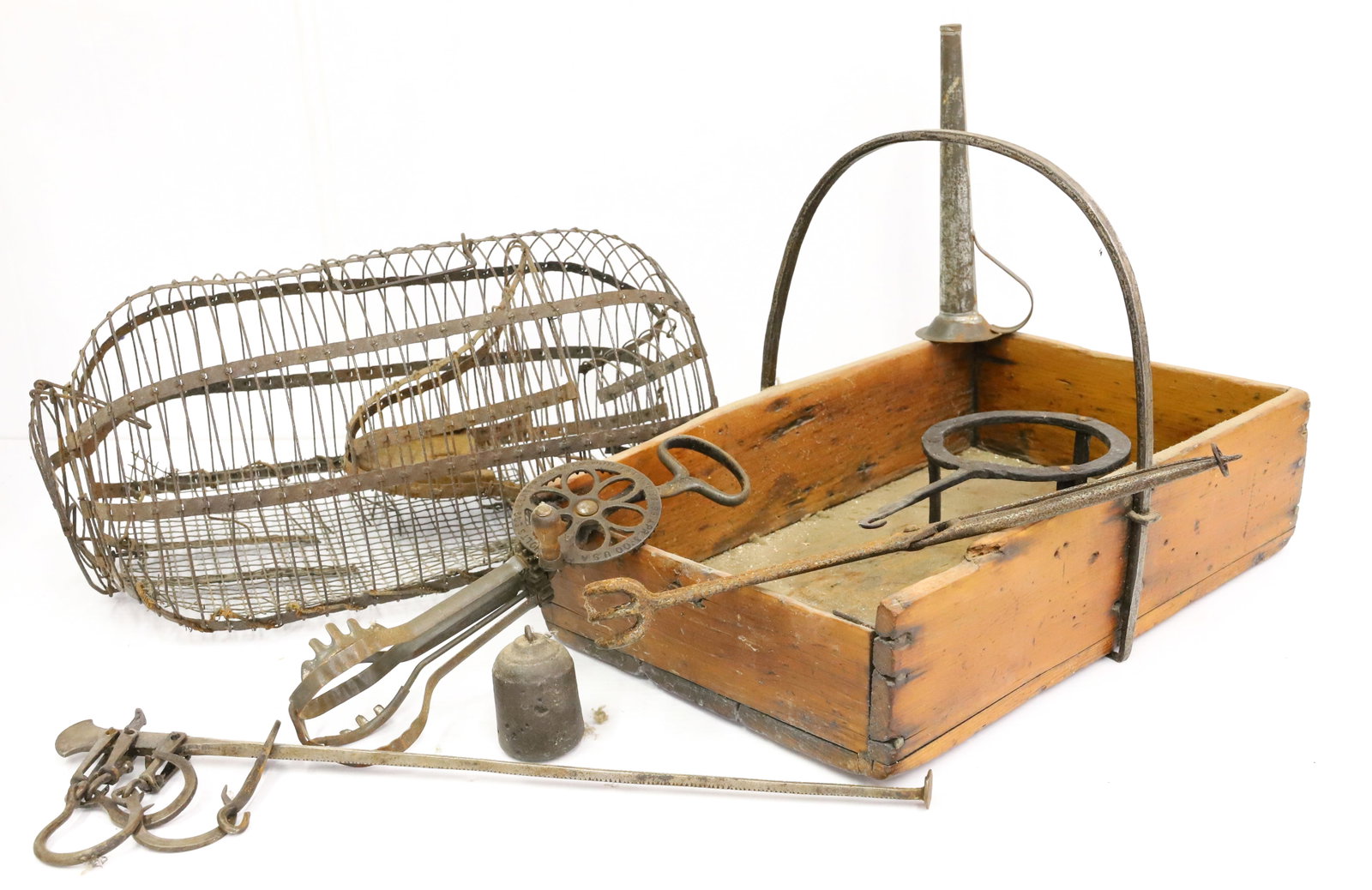 LOT OF COUNTRY PRIMITIVES: WOODEN CARRIER WITH IRON HANDLE 15" L., WIRE TRAP 15" L. , TONGS, EGGBEATER, SCALE AND MORE. PLEASE READ CAREFULLY - Terms for Purchasing and Shipping of Auction Items. Please read carefully before bi