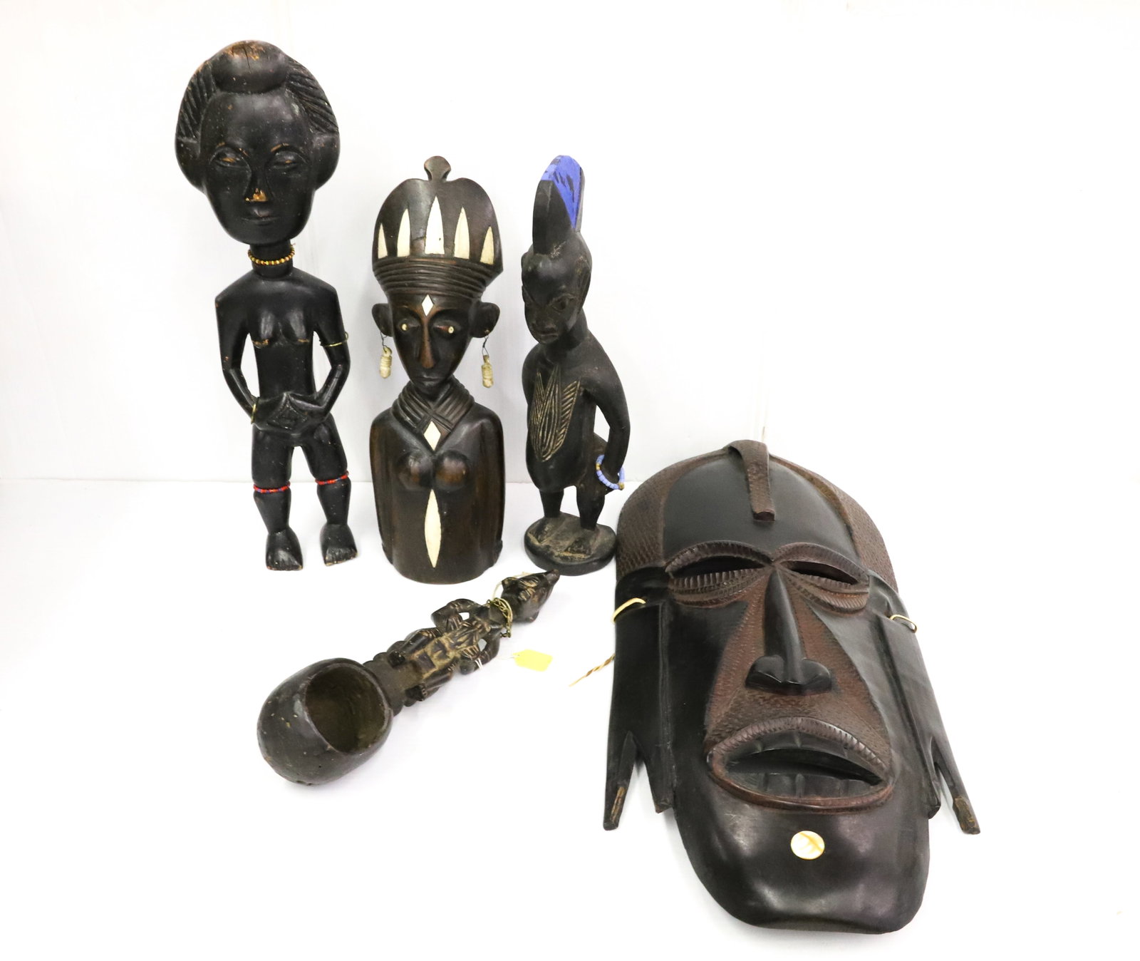CARVED TRIBAL MASK AND FIGURES: LARGE CARVED MASK, FIGURE WITH BONE INLAID HIGHLIGHTS - MASK 23 1/2" AND FIGURE 15" LARGEST IS EMBELLISHED WITH BEADS, 17 1/2" H - SMALLEST IS A LADLE WITH CARVED WOMAN HANDLE ( 12 1/2" ) PLEASE READ 
