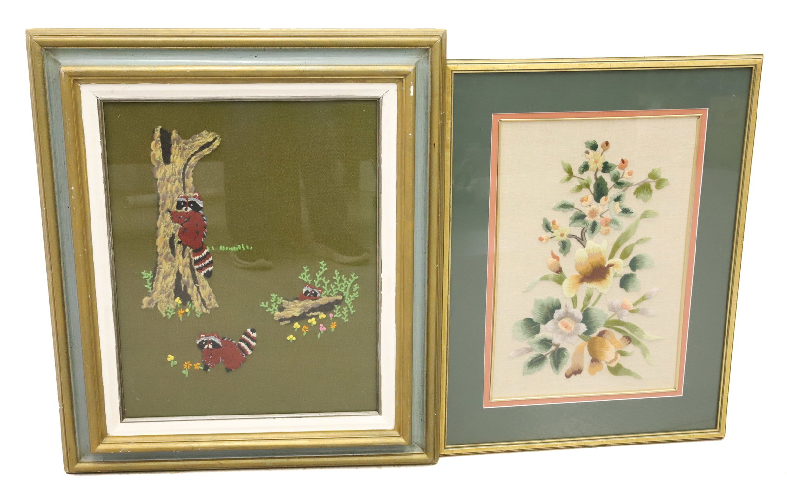 (2) HANDCRAFTED WALL HANGINGS: FLORAL AND RACOONS. FRAMED UNDER GLASS. LARGEST 23 1/2" X 21 1/2". PLEASE READ CAREFULLY - Terms for Purchasing and Shipping of Auction Items. Please read carefully before bidding. All payments for pu