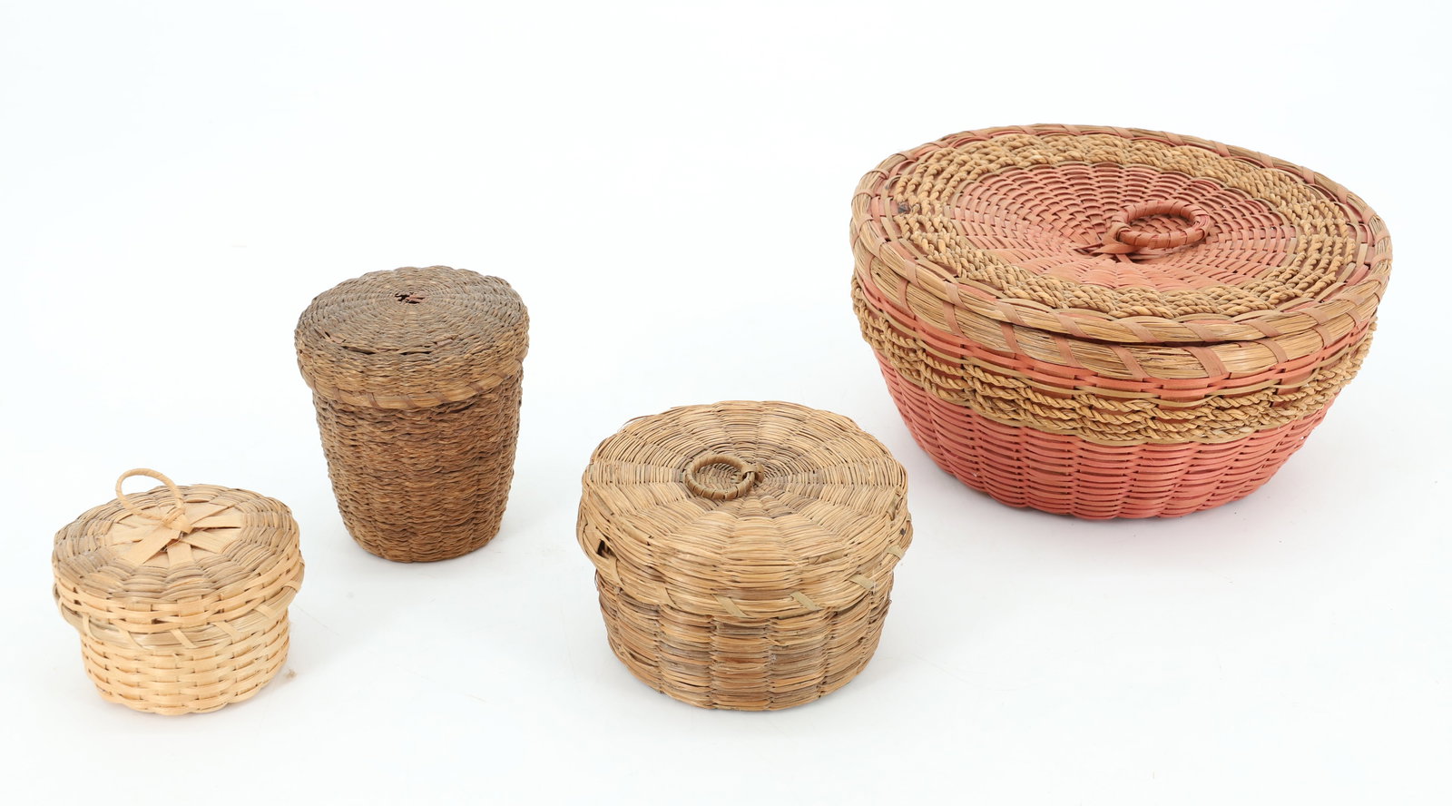LOT OF NATIVE AMERICAN BASKETS: FOUR VARIOUS SIZES AND SHAPES. LARGEST 6 1/4" D. PLEASE READ CAREFULLY BEFORE BIDDING. ALL PAYMENTS MUST BE MADE BEFORE ITEMS CAN BE SHIPPED. BUYERS CAN PAY VIA LIVE AUCTIONEERS PAYMENT CENTER IF HAVI