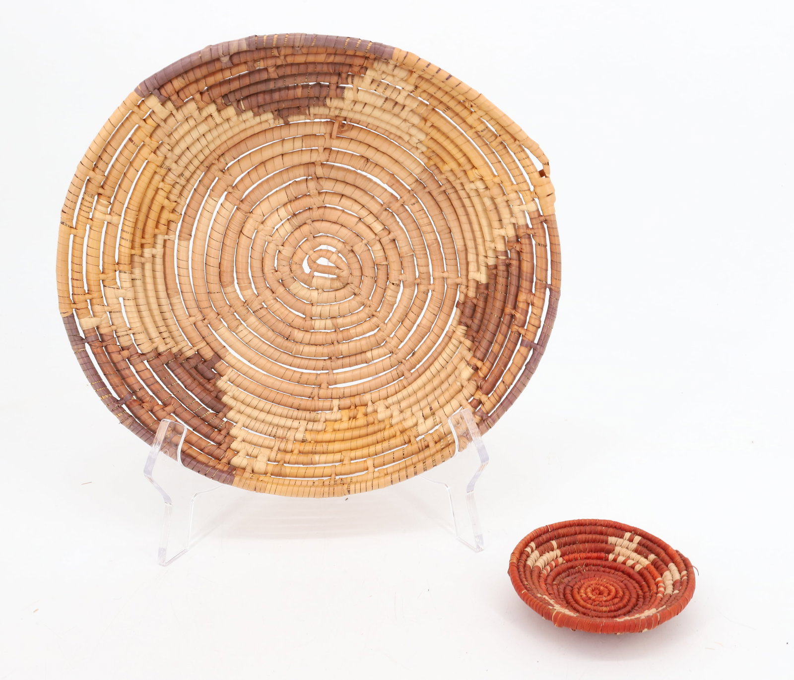 (2) NATIVE AMERICAN BASKETS: TWO SHALLOW BASKETS. SMALLER HAS ANIMAL MOTIF 4" D. PLEASE READ CAREFULLY BEFORE BIDDING. ALL PAYMENTS MUST BE MADE BEFORE ITEMS CAN BE SHIPPED. BUYERS CAN PAY VIA LIVE AUCTIONEERS PAYMENT CENTER IF H