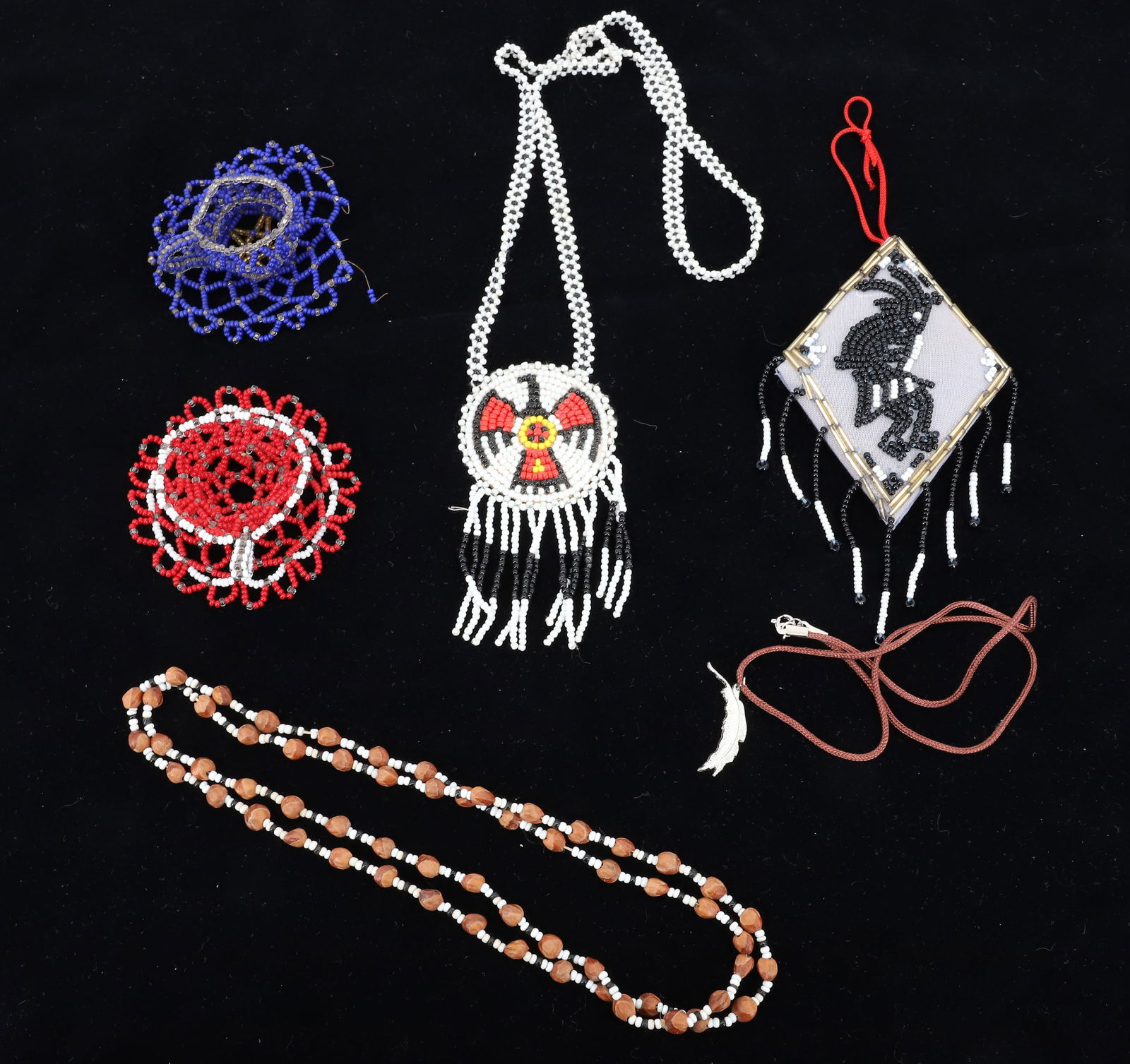 LOT OF NATIVE AMERICAN BEADWORK: INCLUDING: THUNDERBIRD NECKLACE, TWO BEADED CUP/SAUCERS, ORNAMENT AND MORE. PLEASE READ CAREFULLY BEFORE BIDDING. ALL PAYMENTS MUST BE MADE BEFORE ITEMS CAN BE SHIPPED. BUYERS CAN PAY VIA LIVE AUCTION