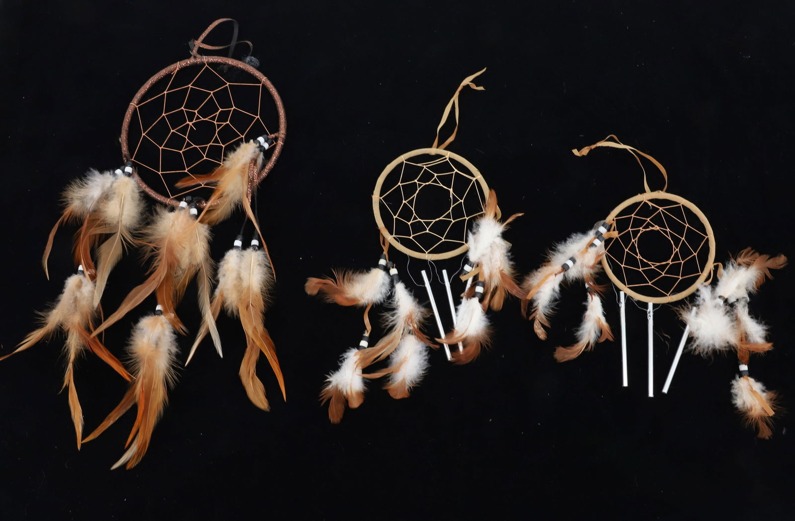 LOT OF DREAM CATCHERS: (3) FEATHER AND BEADED DREAMCATCHERS. PLEASE READ CAREFULLY BEFORE BIDDING. ALL PAYMENTS MUST BE MADE BEFORE ITEMS CAN BE SHIPPED. BUYERS CAN PAY VIA LIVE AUCTIONEERS PAYMENT CENTER IF HAVING ITEMS SH