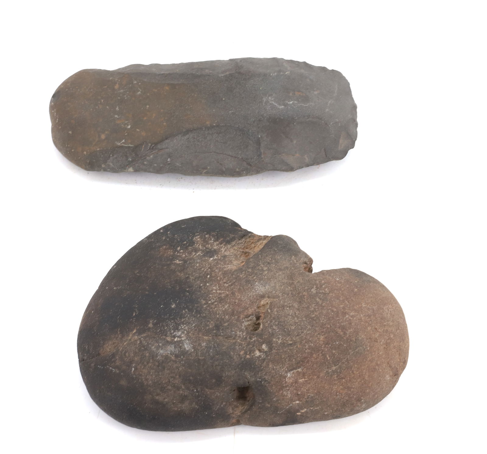 (2) NATIVE AMERICAN STONE IMPLEMENTS: ELONGATED TOOL OR PROJECTILE (6" L.) WITH STONE WITH WORN HOLES (FACE SHAPED) PLEASE READ CAREFULLY BEFORE BIDDING. ALL PAYMENTS MUST BE MADE BEFORE ITEMS CAN BE SHIPPED. BUYERS CAN PAY VIA LIVE AUCTI