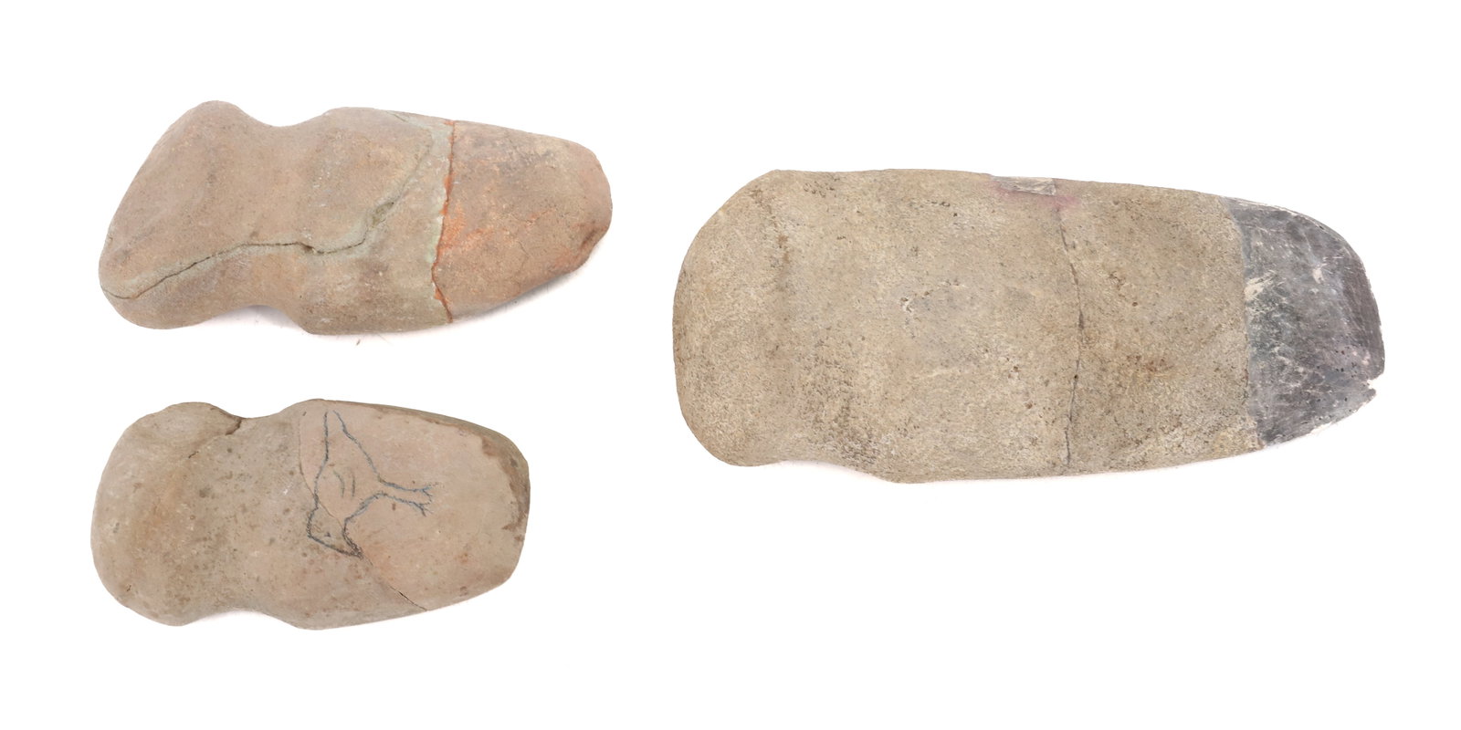 (3) STONE AXE HEADS: GROOVED AXE HEADS. 4" TO 6 1/2" LENGTHS. PLEASE READ CAREFULLY BEFORE BIDDING. ALL PAYMENTS MUST BE MADE BEFORE ITEMS CAN BE SHIPPED. BUYERS CAN PAY VIA LIVE AUCTIONEERS PAYMENT CENTER IF HAVING ITEMS