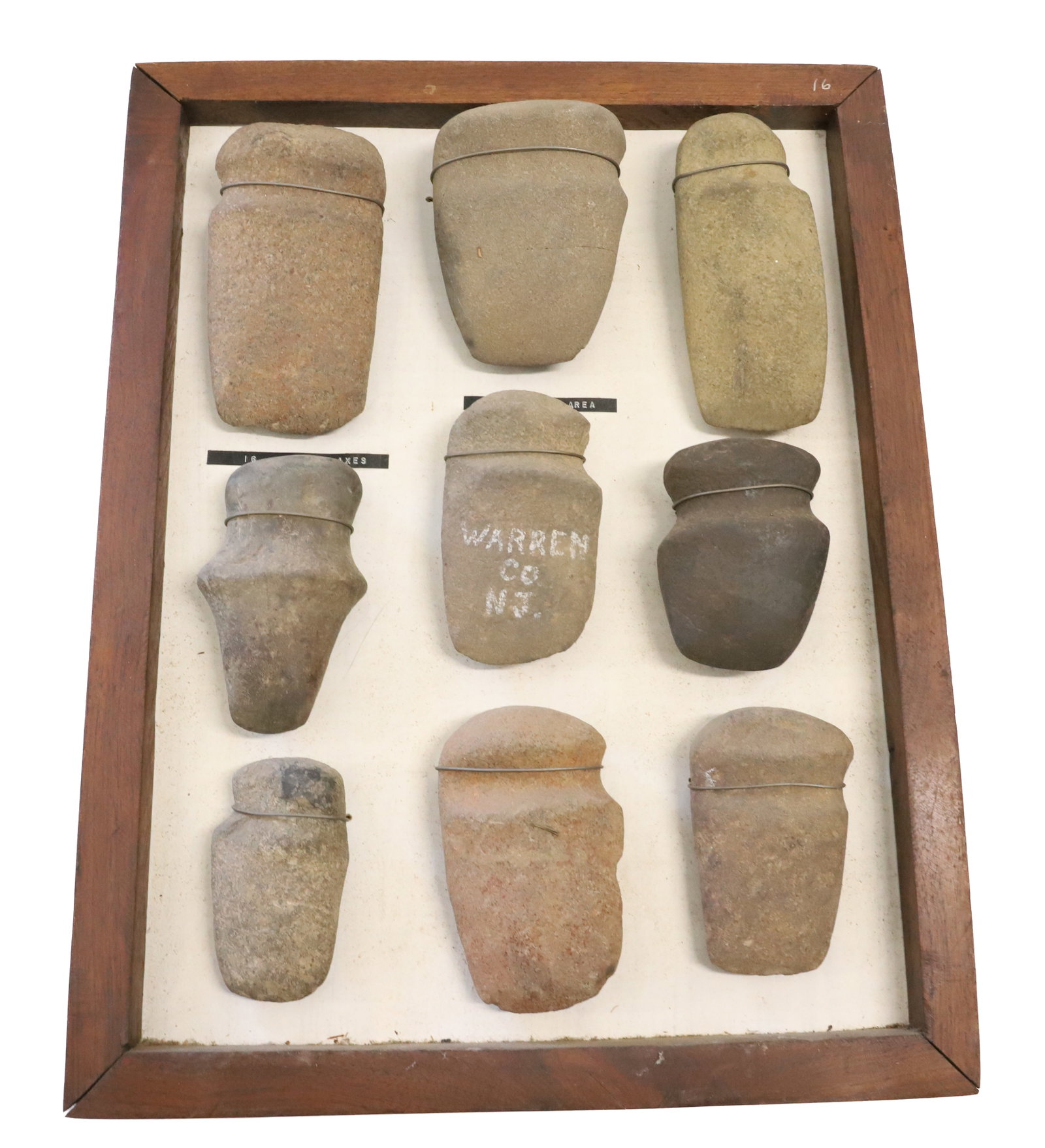 COLLECTION OF STONE AXES: (9) VARIOUS SIZED AXES WIRED TO BACKING. CENTER EXAMPLE MRKD. WARREN CO. NJ. LONGEST 5 3/4". PLEASE READ CAREFULLY BEFORE BIDDING. ALL PAYMENTS MUST BE MADE BEFORE ITEMS CAN BE SHIPPED. BUYERS CAN PAY