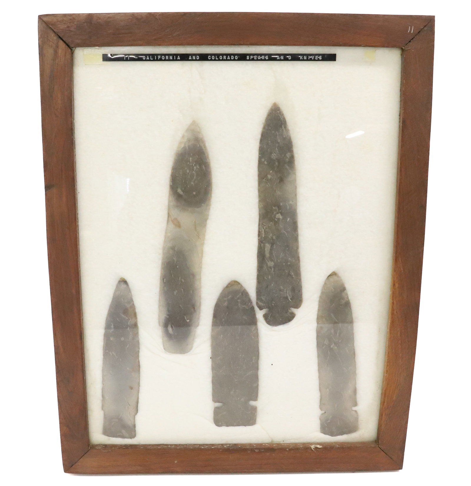 FRAMED COLLECTION OF SPEARS AND KNIVES: IDENTIFIED AS CALIFORNIA AND COLORADO. LARGEST 8 5/8". PLEASE READ CAREFULLY BEFORE BIDDING. ALL PAYMENTS MUST BE MADE BEFORE ITEMS CAN BE SHIPPED. BUYERS CAN PAY VIA LIVE AUCTIONEERS PAYMENT CENTER I