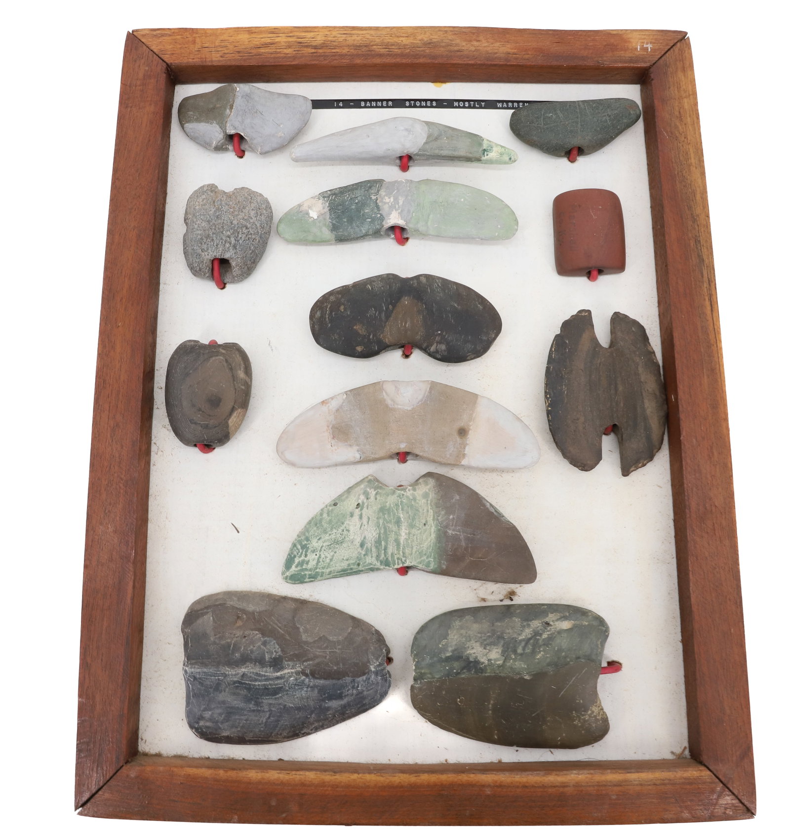FRAMED COLLECTION OF BANNER STONES: (13) STONES WIRED TO BACKING. VARIOUS SIZES, SHAPES AND MATERIALS. LONGEST 5 1/2" L. IDENTIFIED AS MOSTLY WARREN COUNTY, NJ. PLEASE READ CAREFULLY BEFORE BIDDING. ALL PAYMENTS MUST BE MADE BEFORE ITEM