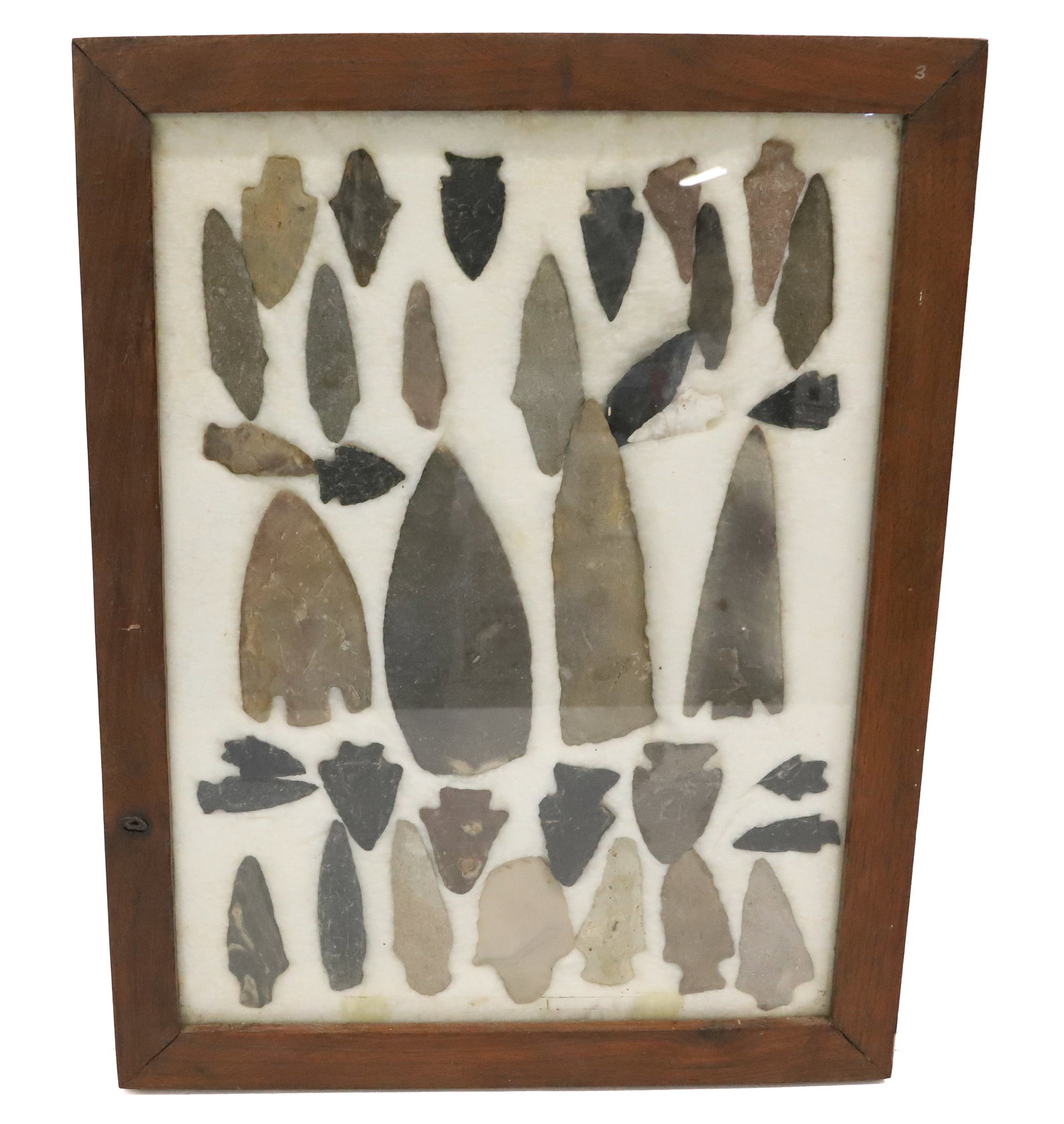 FRAMED COLLECTION OF NATIVE AMERICAN ARTIFACTS: INCLUDING: KNIVES, SPEARS AND ARROW POINTS. LARGEST 5 1/2" L. PLEASE READ CAREFULLY BEFORE BIDDING. ALL PAYMENTS MUST BE MADE BEFORE ITEMS CAN BE SHIPPED. BUYERS CAN PAY VIA LIVE AUCTIONEERS PAYMENT C