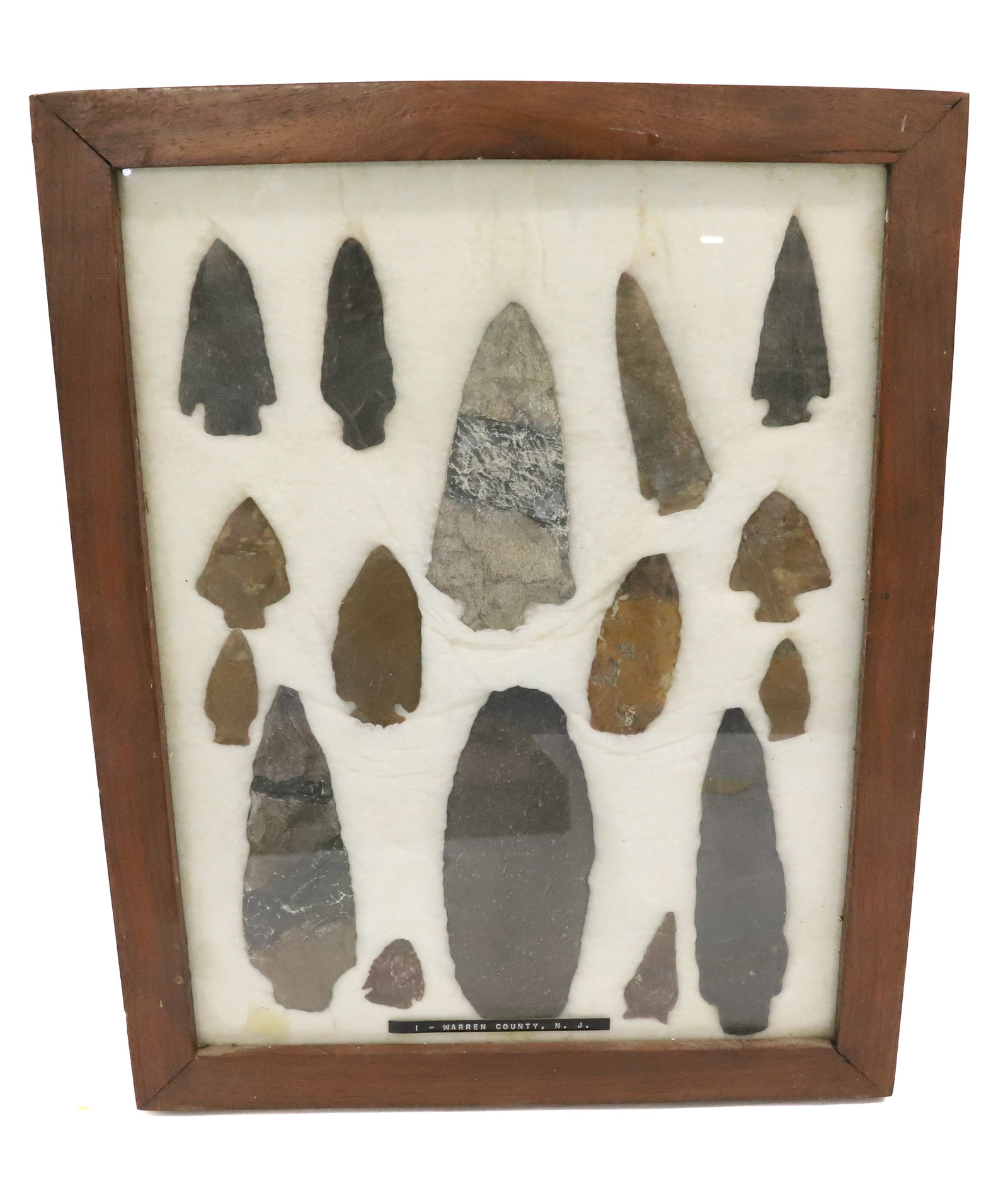 FRAMED COLLECTION OF NATIVE AMERICAN ARTIFACTS: ARROWHEADS AND SPEARS. IDENTIFIED AS WARREN COUNTY, NJ. LARGEST 6 1/4" L. PLEASE READ CAREFULLY BEFORE BIDDING. ALL PAYMENTS MUST BE MADE BEFORE ITEMS CAN BE SHIPPED. BUYERS CAN PAY VIA LIVE AUCTIONEE