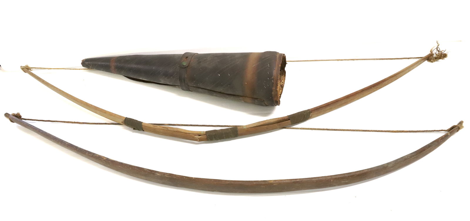 (2) WOODEN BOWS AND QUIVER: BIRCH BARK QUIVER 20" L. BENTWOOD BOWS. 38 1/2" AND 41" LENGTHS. PLEASE READ CAREFULLY BEFORE BIDDING. ALL PAYMENTS MUST BE MADE BEFORE ITEMS CAN BE SHIPPED. BUYERS CAN PAY VIA LIVE AUCTIONEERS PAYMEN