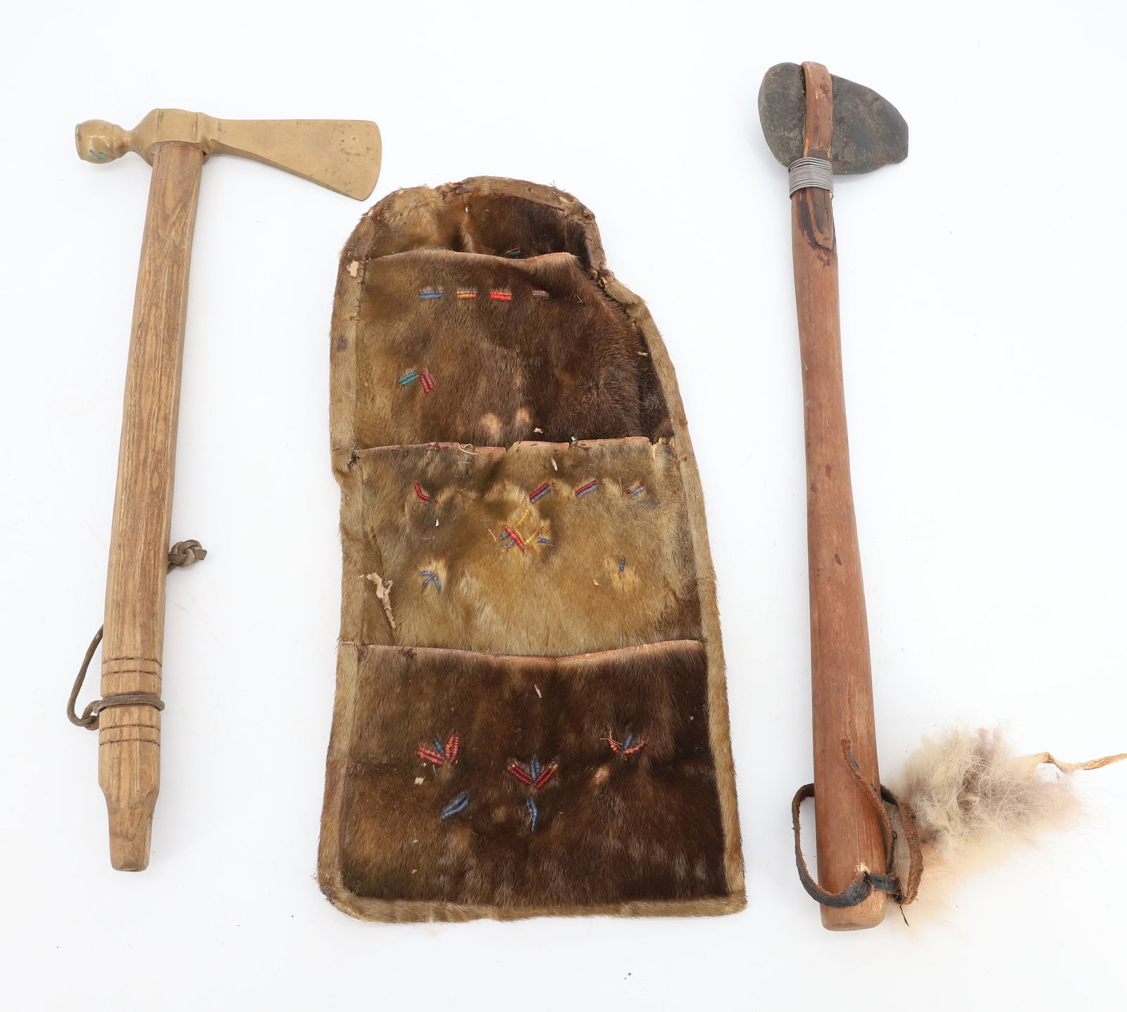 LOT OF NATIVE AMERICAN ARTIFACTS: BRASS TOMAHAWK PIPE 17" L., STONE HEAD CLUB 3 3/4" HEAD. WITH, BEADED THREE-POCKET FUR BAG 15 3/4" L. PLEASE READ CAREFULLY BEFORE BIDDING. ALL PAYMENTS MUST BE MADE BEFORE ITEMS CAN BE SHIPPED. BUYER