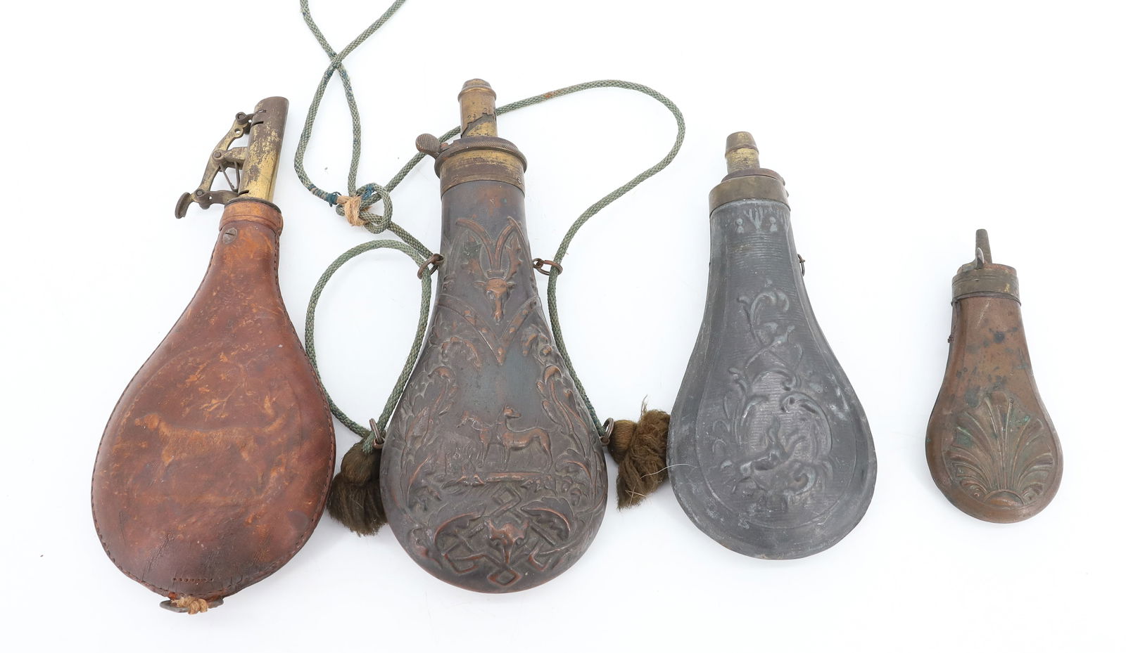 LOT OF POWDER FLASKS: (4) COPPER, METAL AND LEATHER. ONE HAS PAIR OF HUNTING DOGS. LARGEST 8 1/4" L. PLEASE READ CAREFULLY BEFORE BIDDING. ALL PAYMENTS MUST BE MADE BEFORE ITEMS CAN BE SHIPPED. BUYERS CAN PAY VIA LIVE AUCT