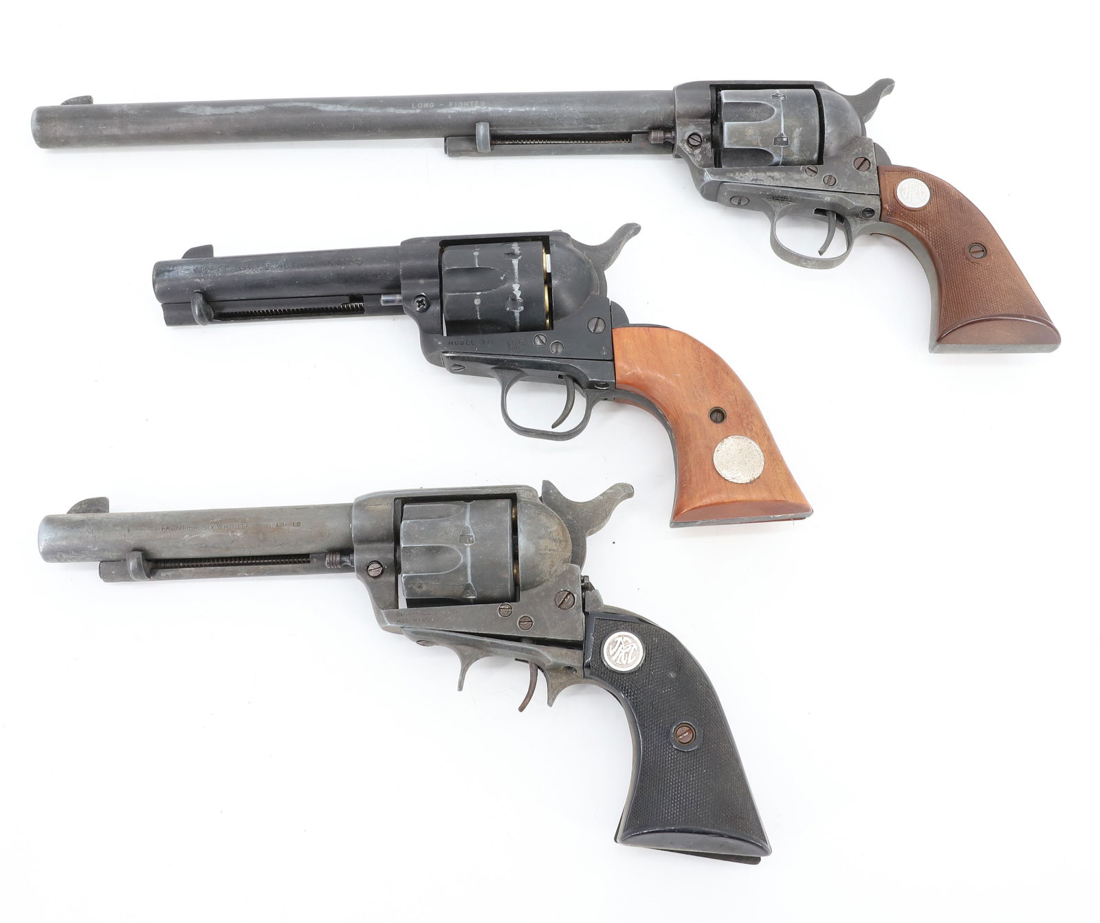 (3) PROP (REPLICA) GUNS: LARGEST 17 1/4" L. (LONG FIGHTER NO. 1865), MODEL SINGLE ACTION ARMY 45 MODEL 1874 AND FRONTIER SIX SHOOTER 44-40 LONG BLANK. PLEASE READ CAREFULLY BEFORE BIDDING. ALL PAYMENTS MUST BE MADE BEFORE ITE