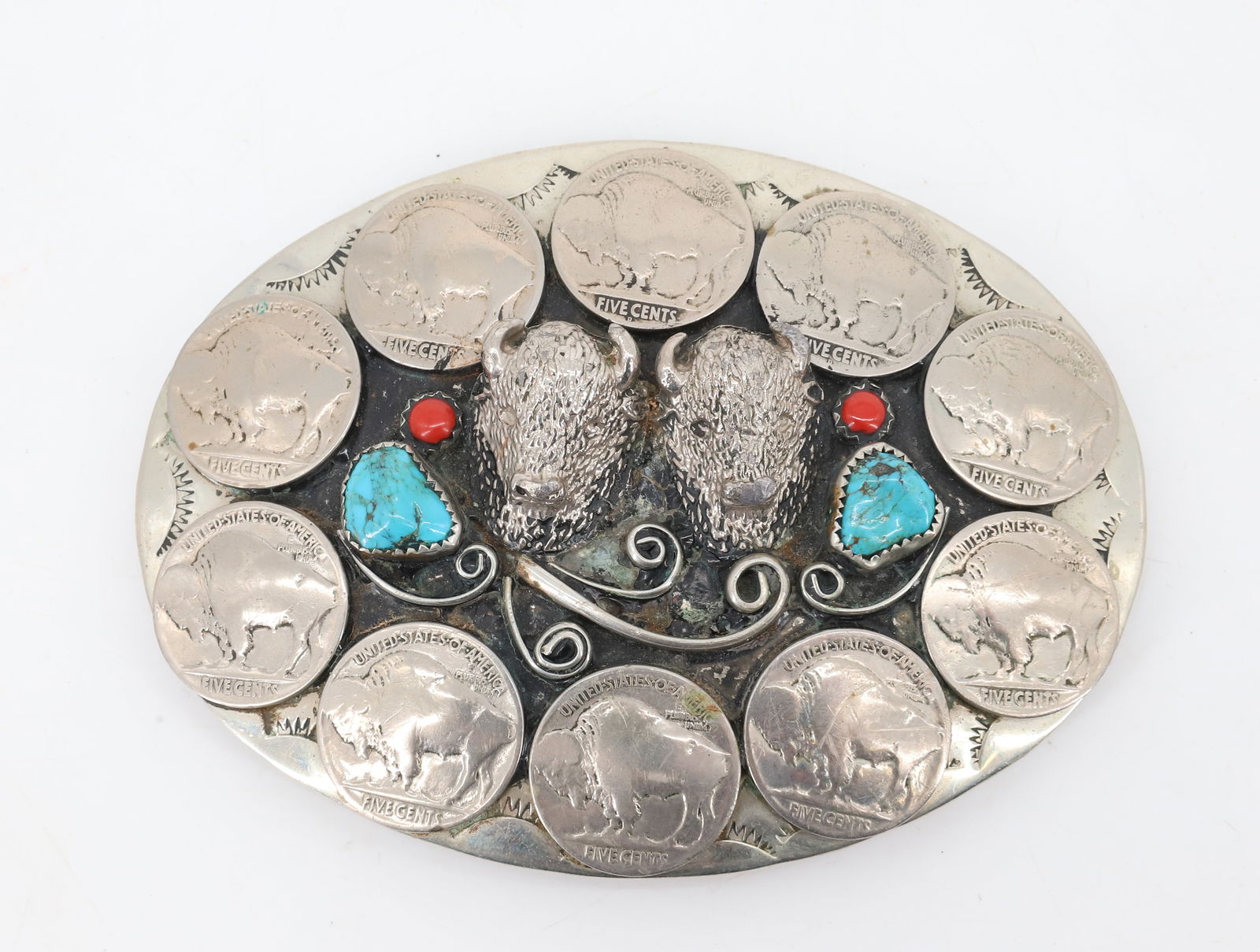LARGE NATIVE AMERICAN BELT BUCKLE: BUFFALO NICKELS ON NICKEL SILVER. TWO BUFFALO HEADS WITH TURQUOISE AND CORAL STONES. UNMARKED. 4 1/4" X 3 1/4". PLEASE READ CAREFULLY BEFORE BIDDING. ALL PAYMENTS MUST BE MADE BEFORE ITEMS CAN BE SHIP