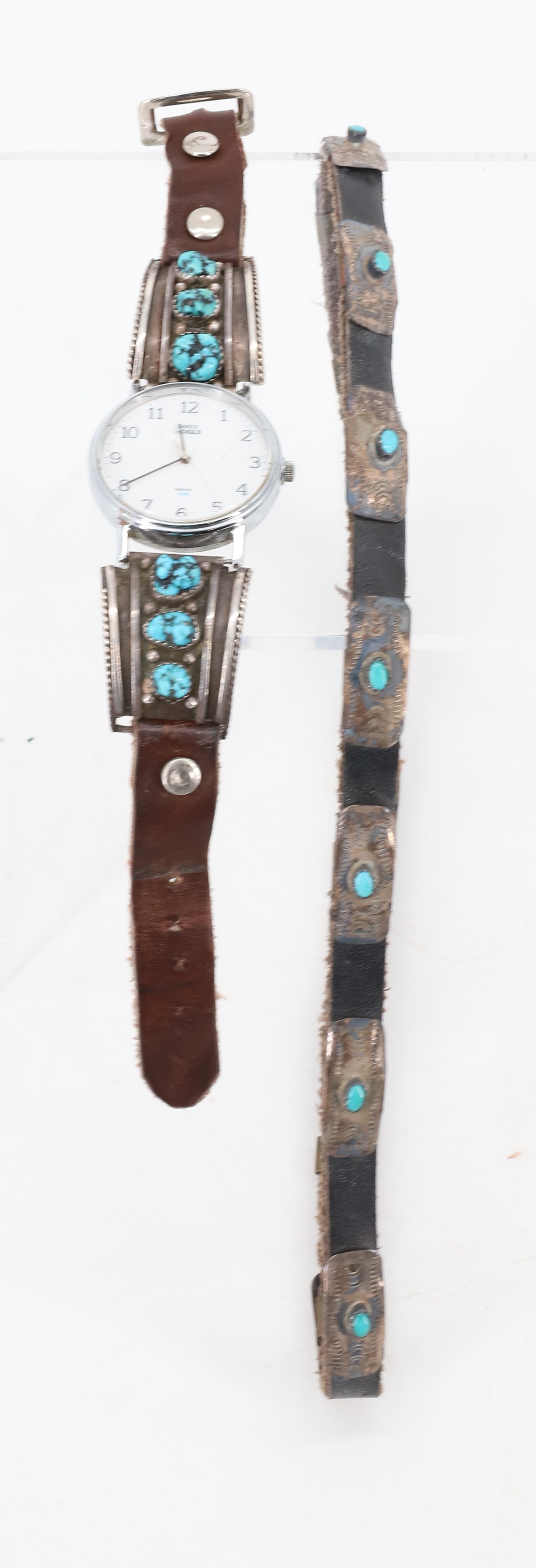 NATIVE AMERICAN HAT BAND AND WATCH BAND: SILVER/TURQUOISE APPROX. 21" TOTAL. STERLING/LEATHER BANDED WATCH. MRKD. STERLING AND "AT". WATCH IS TIMEX INDIGLO QUARTZ. PLEASE READ CAREFULLY BEFORE BIDDING. ALL PAYMENTS MUST BE MADE BEFORE ITEMS