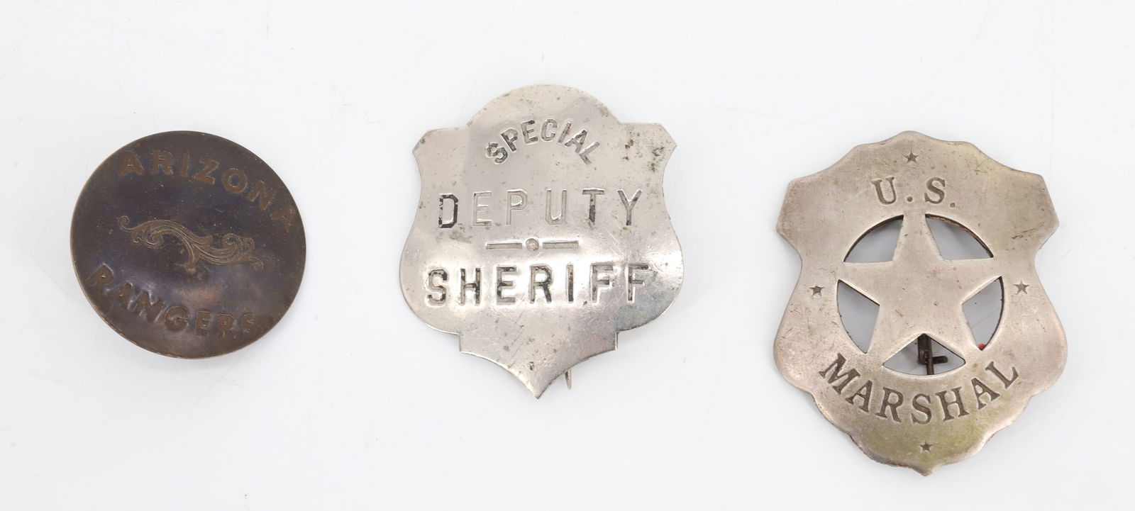 LOT OF MARSHAL, SHERIFF, RANGERS BADGES: U.S. MARSHAL BADGE 2 3/4" X 2 1/8", SPECIAL DEPUTY SHERIFF (MRKD. CD REESE, 57 WARREN ST. NY) 2 3/8" X 2 3/16". WITH, ARIZONA RANGERS COPPER BADGE 1 3/4" D. PLEASE READ CAREFULLY BEFORE BIDDING. ALL P