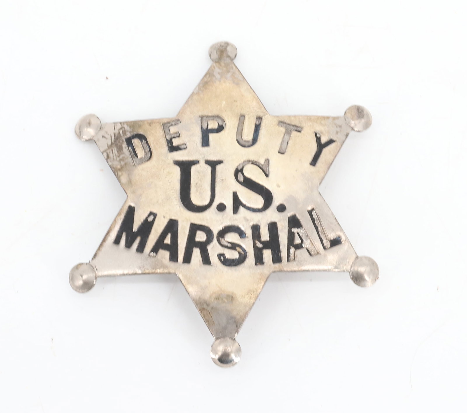 DEPUTY U.S. MARSHAL BADGE: SIX-POINT STAR. MRKD. "ALLEN STAMP AND SEAL CO., KANSAS CITY". 2 5/8" D. PLEASE READ CAREFULLY BEFORE BIDDING. ALL PAYMENTS MUST BE MADE BEFORE ITEMS CAN BE SHIPPED. BUYERS CAN PAY VIA LIVE AUCTIONEER