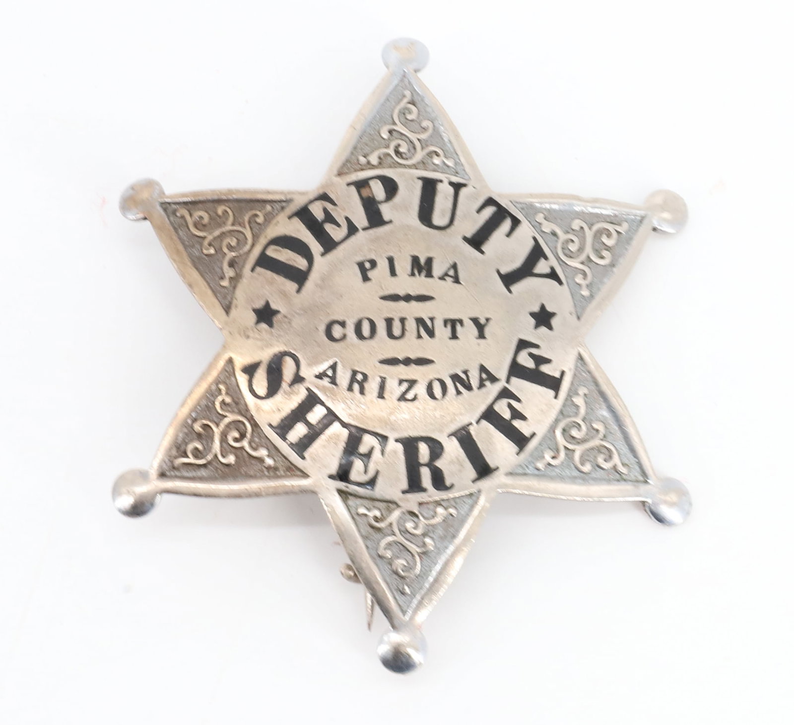 DEPUTY SHERIFF BADGE, ARIZONA: SIX-POINT STAR. PIMA COUNTY, ARIZONA. UNMARKED. 2 1/2" D PLEASE READ CAREFULLY BEFORE BIDDING. ALL PAYMENTS MUST BE MADE BEFORE ITEMS CAN BE SHIPPED. BUYERS CAN PAY VIA LIVE AUCTIONEERS PAYMENT CENTER