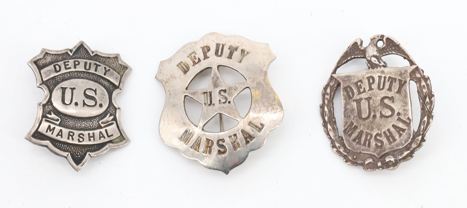 (3) DEPUTY MARSHAL BADGES: ALL "DEPUTY U.S. MARSHALL" 1 3/4" TO 2" L. PLEASE READ CAREFULLY BEFORE BIDDING. ALL PAYMENTS MUST BE MADE BEFORE ITEMS CAN BE SHIPPED. BUYERS CAN PAY VIA LIVE AUCTIONEERS PAYMENT CENTER IF HAVING ITE