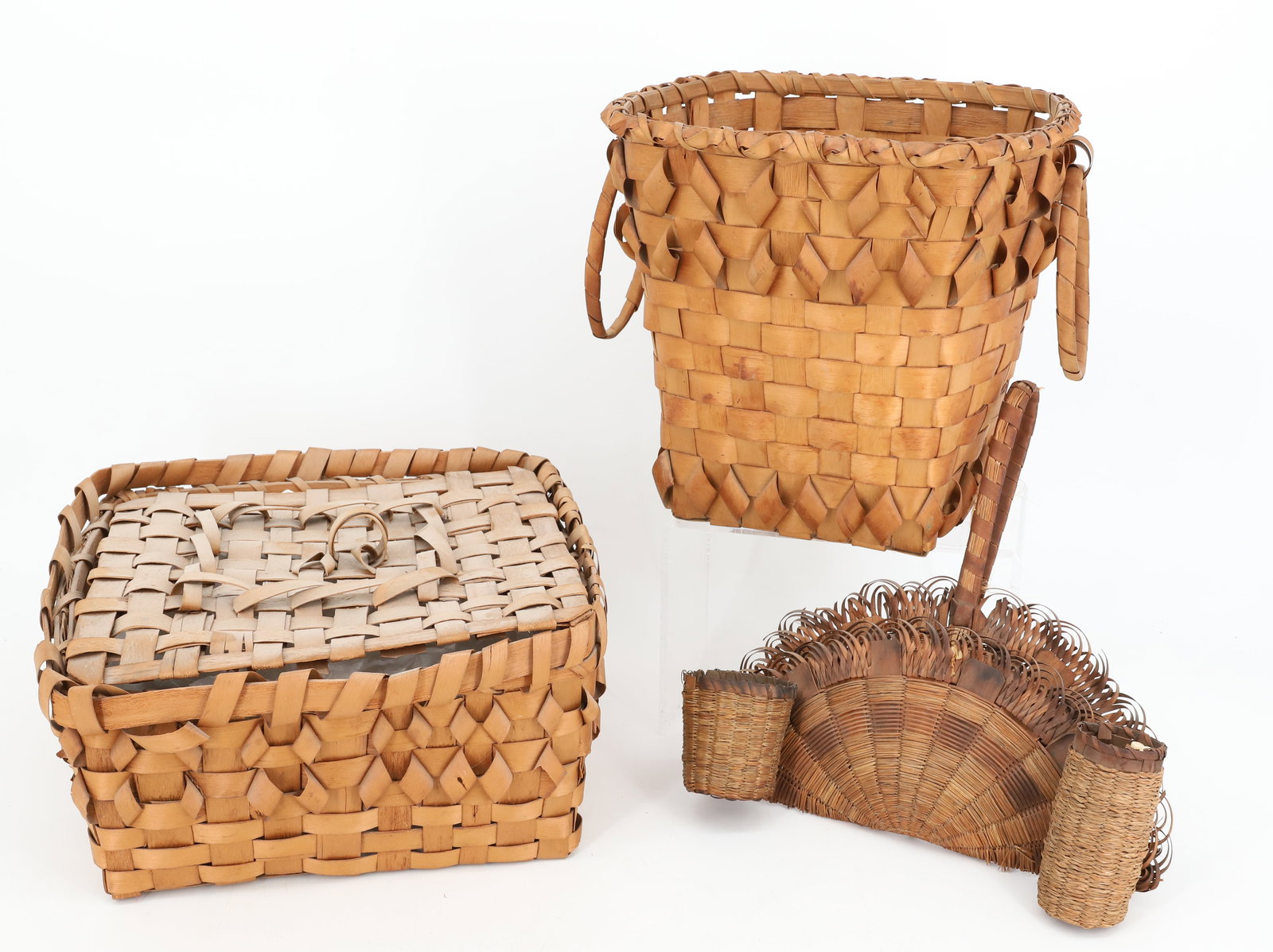 (3) NATIVE AMERICAN "TOURIST" BASKETS: SQUARE BASKET WITH LID 10" X 10". TALL EXAMPLE WITH LARGE RINGS 8 1/2" H. AND FAN SHAPED SEWING BASKET. PLEASE READ CAREFULLY BEFORE BIDDING. ALL PAYMENTS MUST BE MADE BEFORE ITEMS CAN BE SHIPPED. BUY
