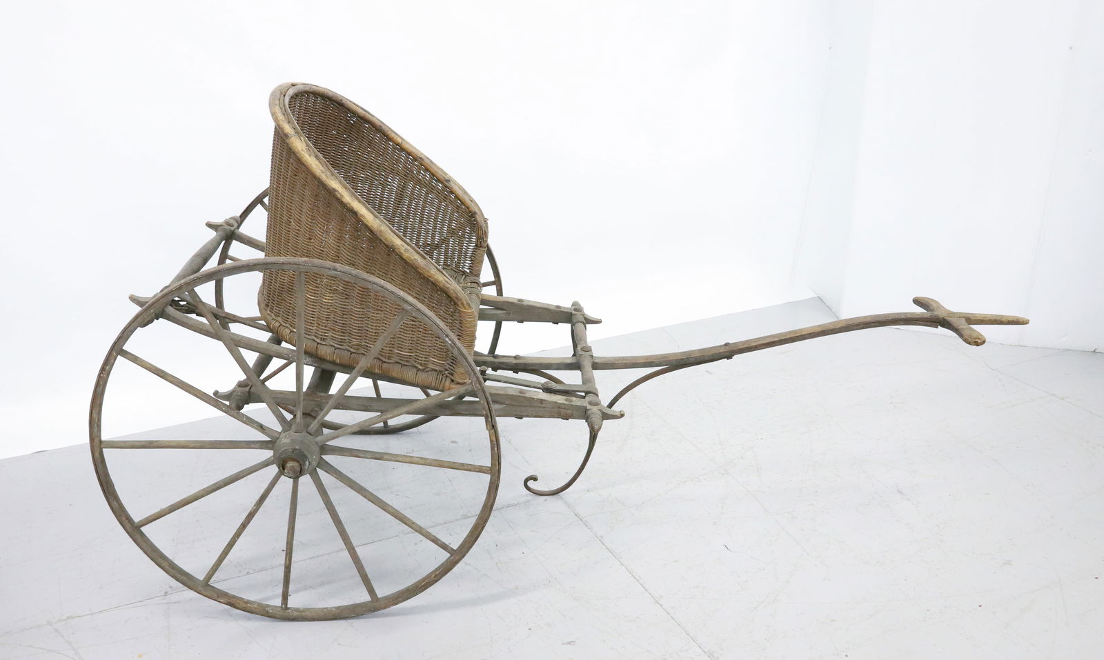 WOOD AND WICKER SULKEY : WOOD FRAME, IRON WHEEL, WICKER SEAT - 60" X 26" WITH 24" WHEELS PLEASE READ CAREFULLY - Terms for Purchasing and Shipping of Auction Items. Please read carefully before bidding. All payments for purch