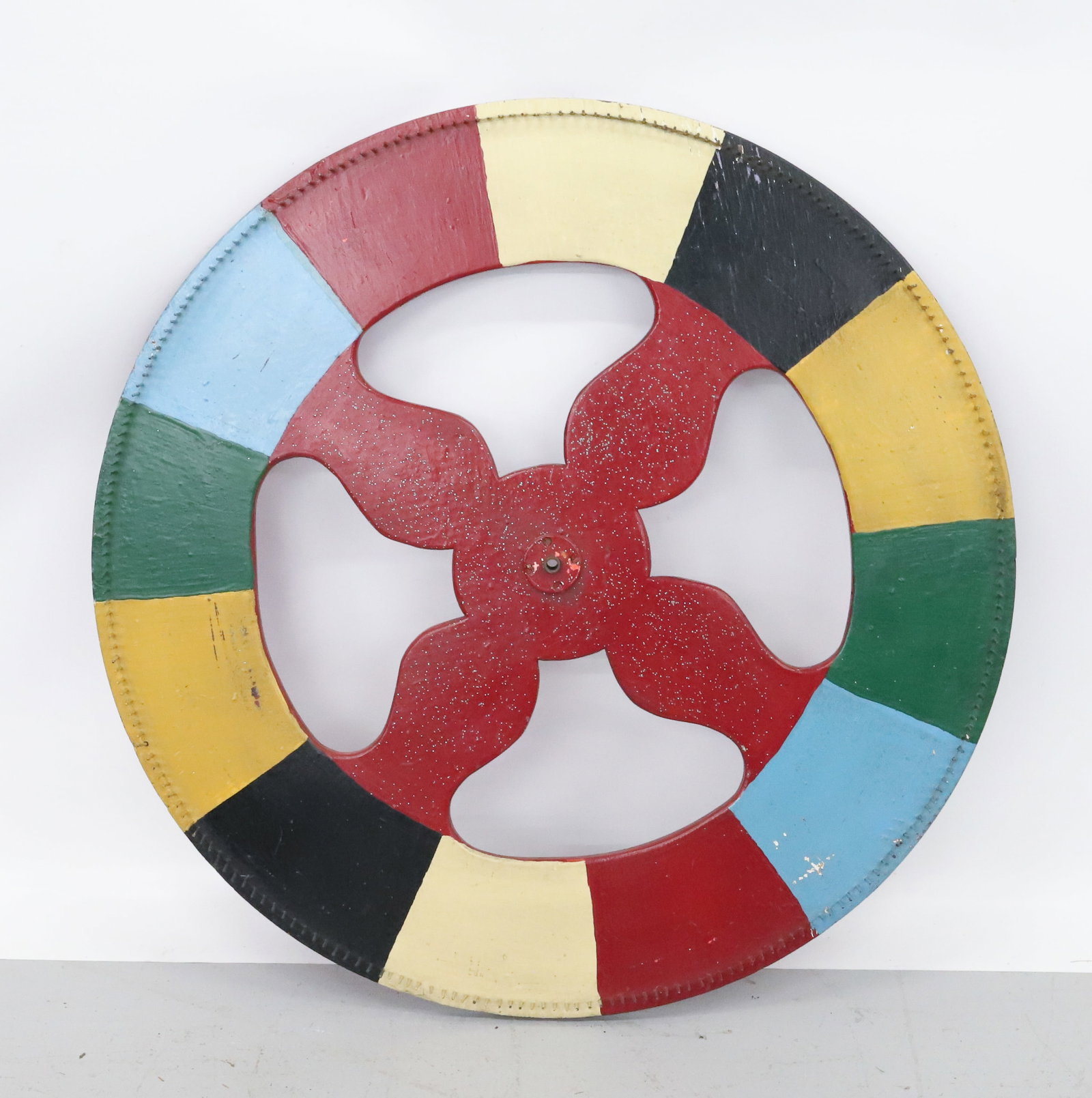 FOLK ART CARNIVAL WHEEL: MULTI-COLOR WOODEN WHEEL WITH METAL SPOKES. 36" D. PLEASE READ CAREFULLY - Terms for Purchasing and Shipping of Auction Items. Please read carefully before bidding. All payments for purchases will be 