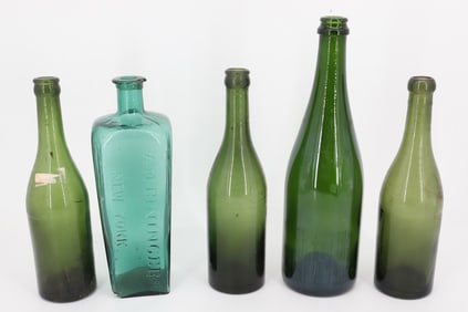 LOT OF GREEN BOTTLES