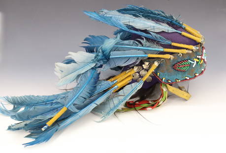 NATIVE AMERICAN HEADDRESS: BLUE FEATHERS ON FELT. BEADWORK AND SILVER DISC ORNAMENTATION. 13" L. PLEASE READ CAREFULLY - Terms for Purchasing and Shipping of Auction Items. Please read carefully before bidding. All payments for