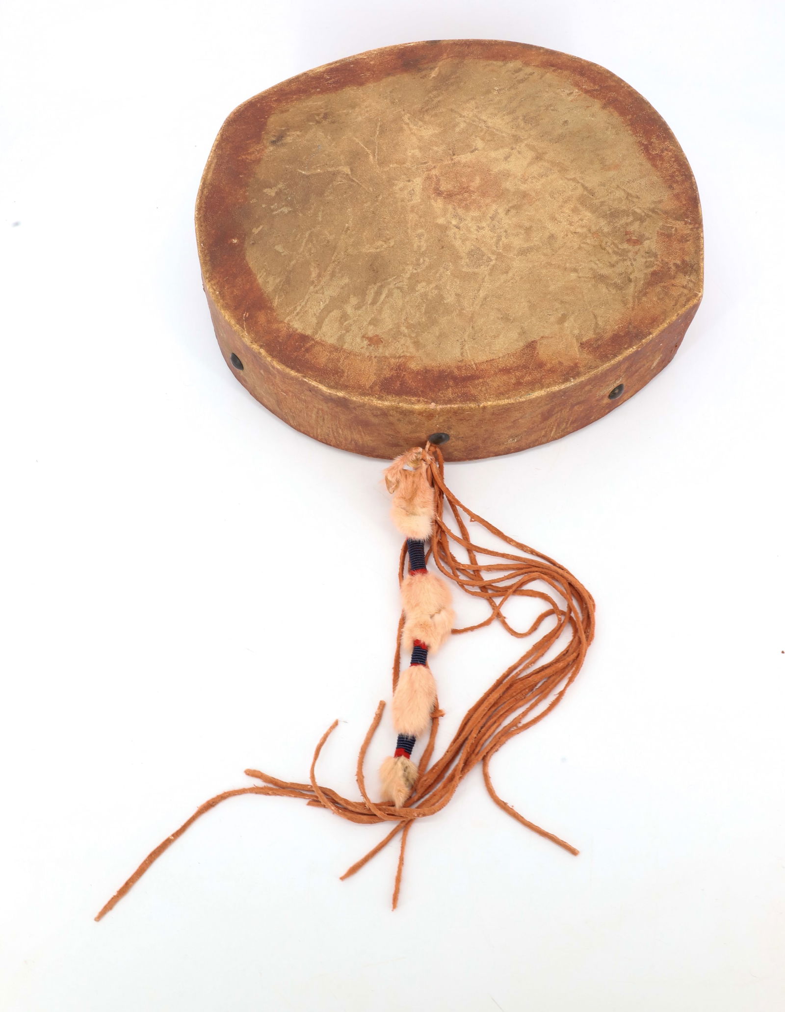 NATIVE AMERICAN DRUM: PAINTED HIDE WITH FRINGE AND BELL. 15 1/2" D. PLEASE READ CAREFULLY - Terms for Purchasing and Shipping of Auction Items. Please read carefully before bidding. All payments for purchases will be made