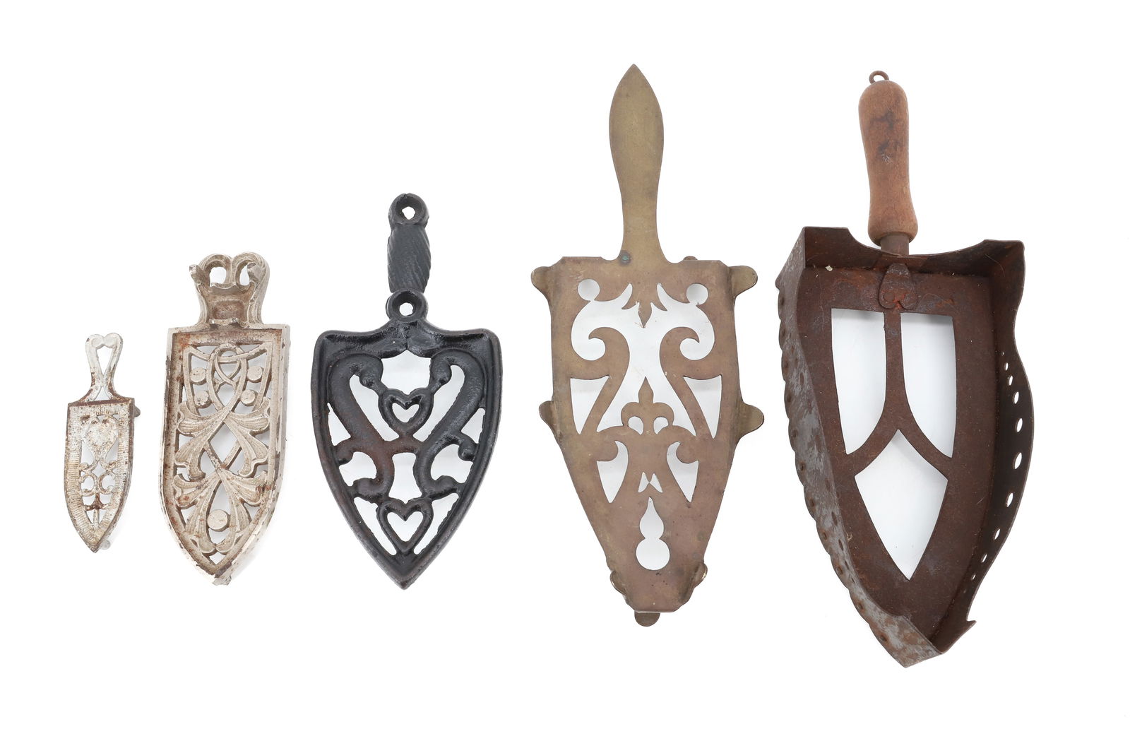 LOT OF (5) ANTIQUE TRIVETS: CAST IRON AND BRASS. SOME PAINTED. 5" TO 14" LENGTHS. PLEASE READ CAREFULLY - Terms for Purchasing and Shipping of Auction Items. Please read carefully before bidding. All payments for purchases will