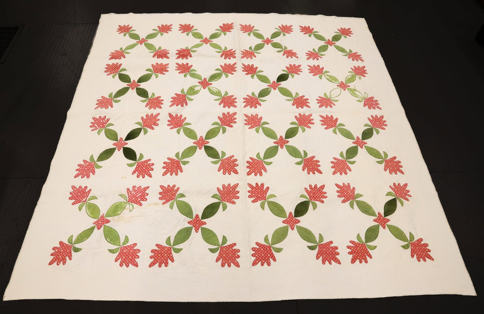 VINTAGE HAND STITCHED QUILT: RED/GREEN ON WHITE BACKGROUND. 75" X 72". PLEASE READ CAREFULLY - Terms for Purchasing and Shipping of Auction Items. Please read carefully before bidding. All payments for purchases will be made thro