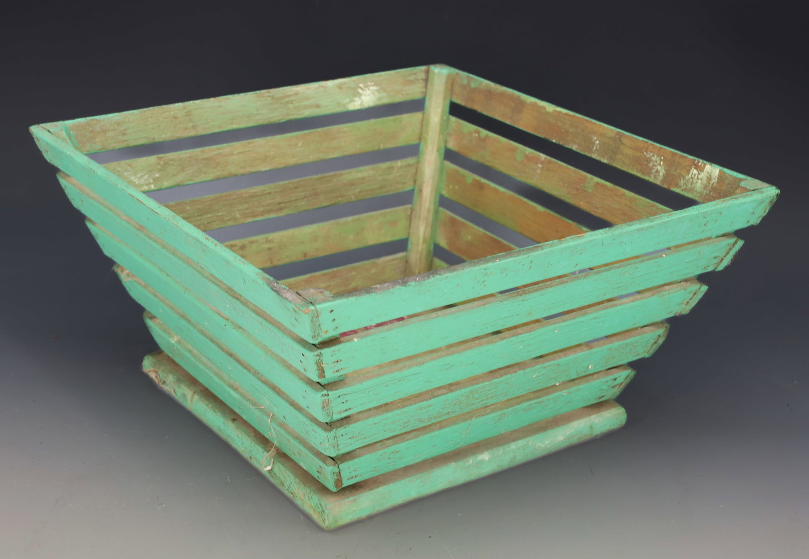 PAINTED SLAT BASKET: GREEN PAINTED WITH CANTED SIDES. 5" X 10" X 10". PLEASE READ CAREFULLY â€“ THIS IS AN IN-PERSON & ON-LINE AUCTION. SALE IS LOCATED IN HARMONY TOWNSHIP, PHILLIPSBURG, NJ â€&