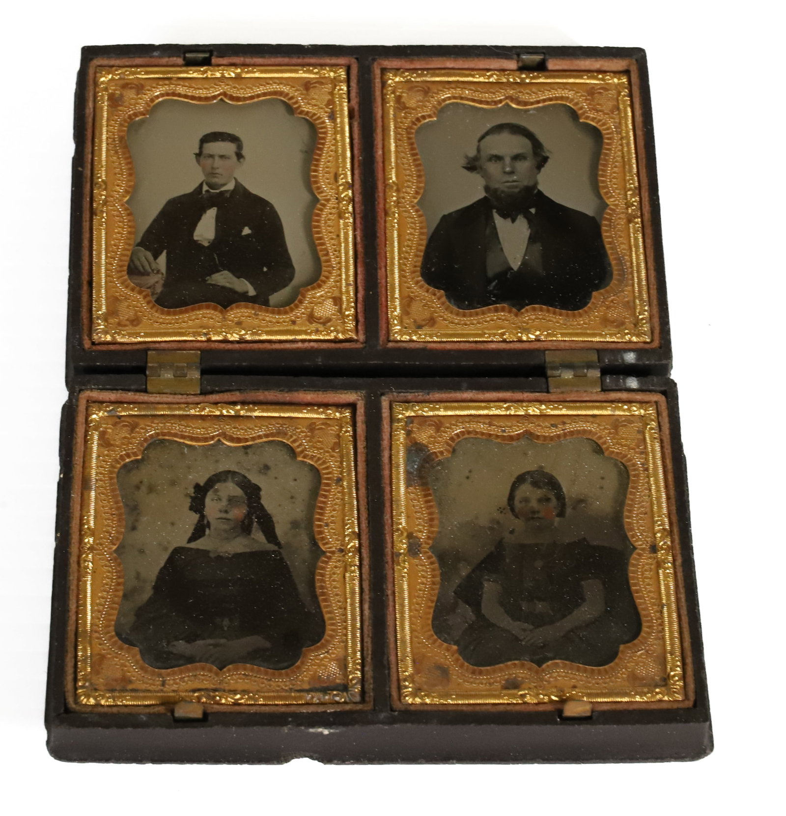 CASE OF (4) AMBROTYPES: OLDER AND YOUNGER MAN WITH TWO YOUNG GIRLS 2 1/2" X 2". IN CASE WITH WOMAN/CHILD/CAT IN RELIEF ON BOTH SIDES.4 1/2" X 2 7/8". PLEASE READ CAREFULLY â€“ THIS IS AN IN-PERSON & ON-LINE 