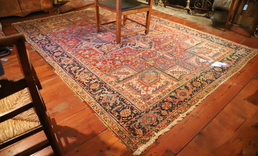 ANTIQUE HERIZ ROOM SIZE RUG: ROOM SIZE. RED WITH FLOWER AND LEAF PATTERN. BLUE BORDER. 11'2" X 8'4". PLEASE READ CAREFULLY &#226;&#8364;&#8220; THIS IS AN IN-PERSON & ON-LINE AUCTION. SALE IS LOCATED IN HARMONY TOWNSHIP, PHILLIPS