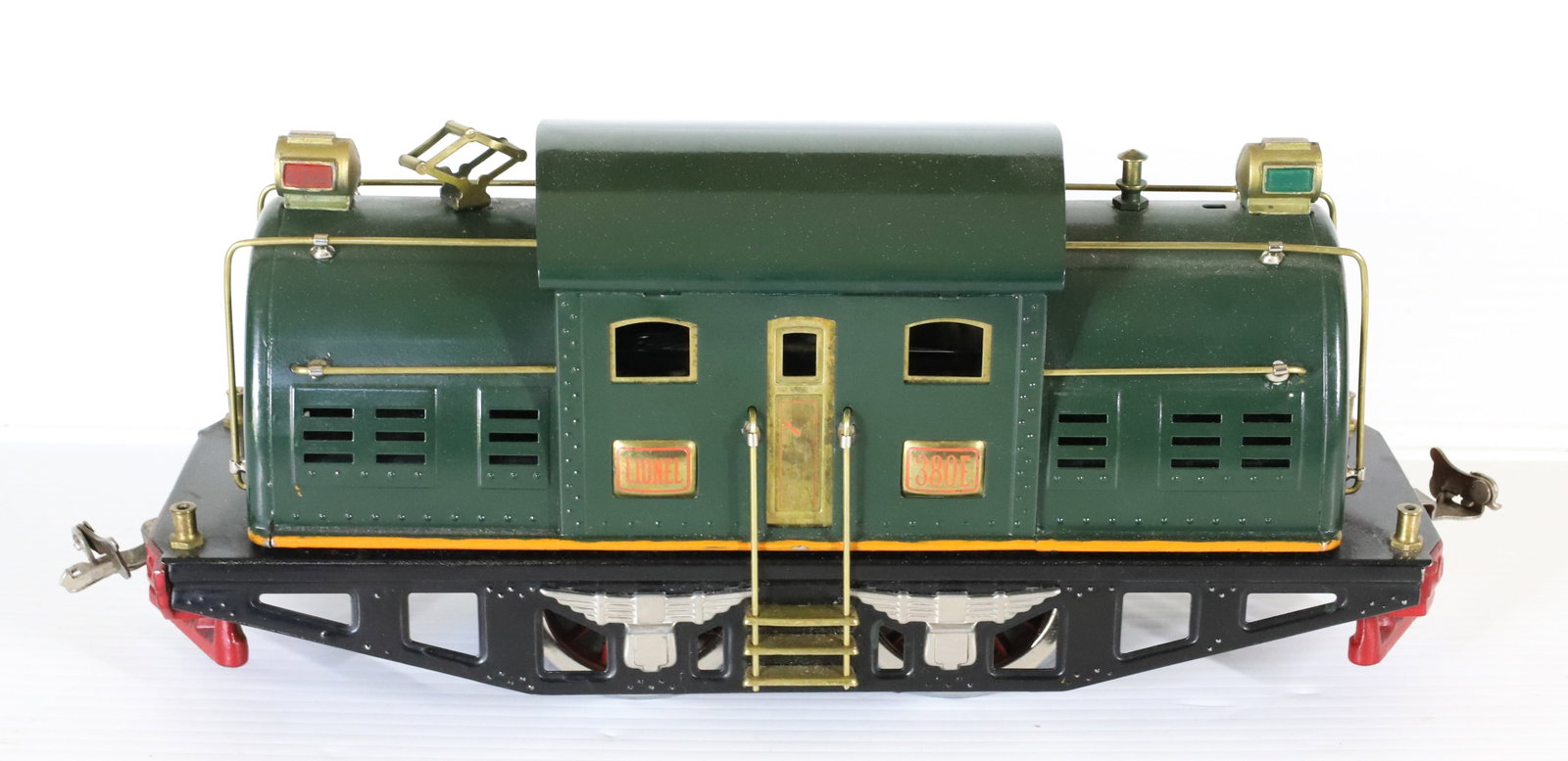LIONEL "380E" STANDARD GAUGE LOCOMOTIVE: GREEN SURFACE WITH ORANGE TRIM. 13" L. PLEASE READ CAREFULLY â€“ THIS IS AN IN-PERSON & ON-LINE AUCTION. SALE IS LOCATED IN HARMONY TOWNSHIP, PHILLIPSBURG, NJ â€“ Ter