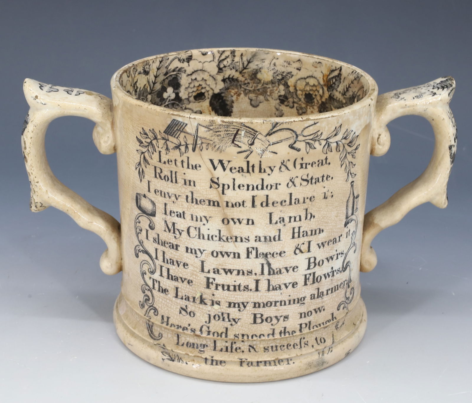 19TH C. TRANSFERWARE LOVING CUP: BLACK TRANSER "GOD SPEED THE PLOUGH" WITH VERSE ON BOTH SIDES. 4 5/8" H. PLEASE READ CAREFULLY â€“ THIS IS AN IN-PERSON & ON-LINE AUCTION. SALE IS LOCATED IN HARMONY TOWNSHIP, PHILLIP