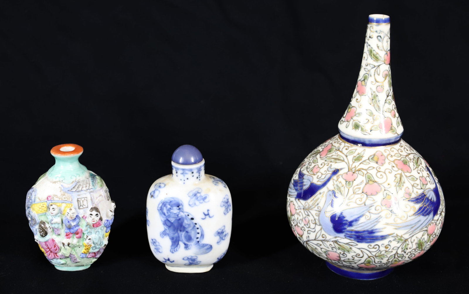 PORCELAIN SNUFF BOTTLES AND VASE: BLUE/WHITE EXAMPLE WITH LID 2 3/4" H., COLORFUL RELIEF EXAMPLE (SGND. BOTTOM) 2 1/2" H. AND FLORAL/BIRD VASE (STAMPED ON BOTTOM) 5 1/4" H. PLEASE READ CAREFULLY â€“ THIS IS AN IN-PERS