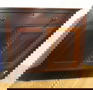 19TH C. SHERATON JAM CUPBOARD: SINGLE DOVETAILED DRAWER OVER TWO PANELED DOORS WITH INTERIOR SHELF. 41 3/4" X 43" X 19 1/2". PLEASE READ CAREFULLY – THIS IS AN IN-PERSON & ON-LINE AUCTION. SALE IS LOCATED IN HARM